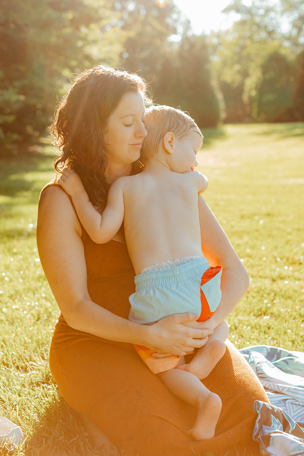 Mama hugging her son. Sunset backyard summer family session in Nashville, TN