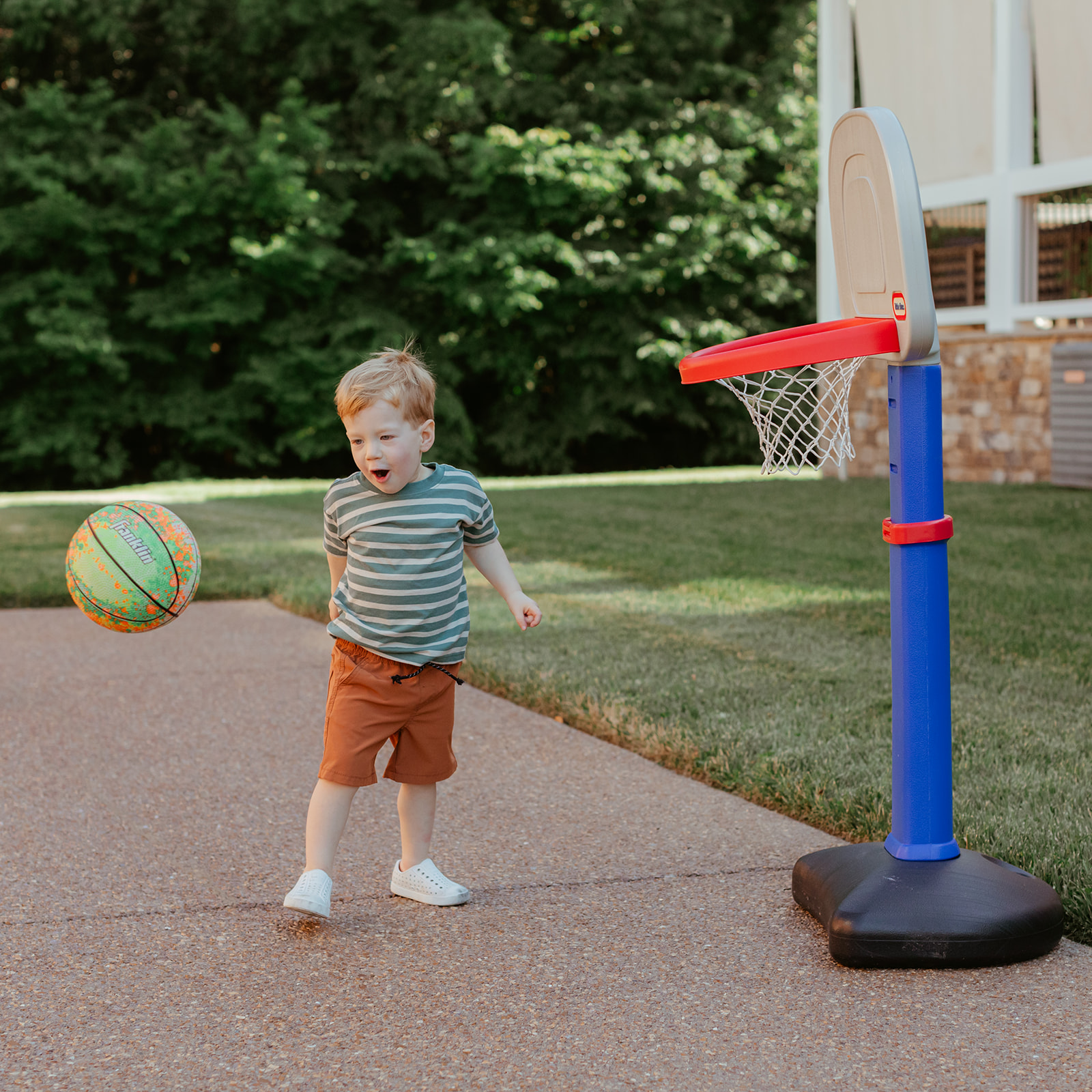 Little boy playing basketball. Backyard summer family session in Nashville, TN