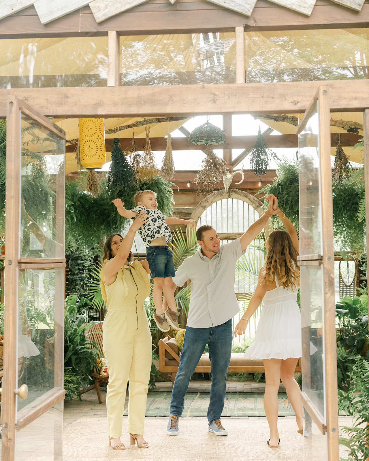 Family of four (mom, dad, first born teen daughter and toddler son). Family photos at Greenhouse in Nashville 