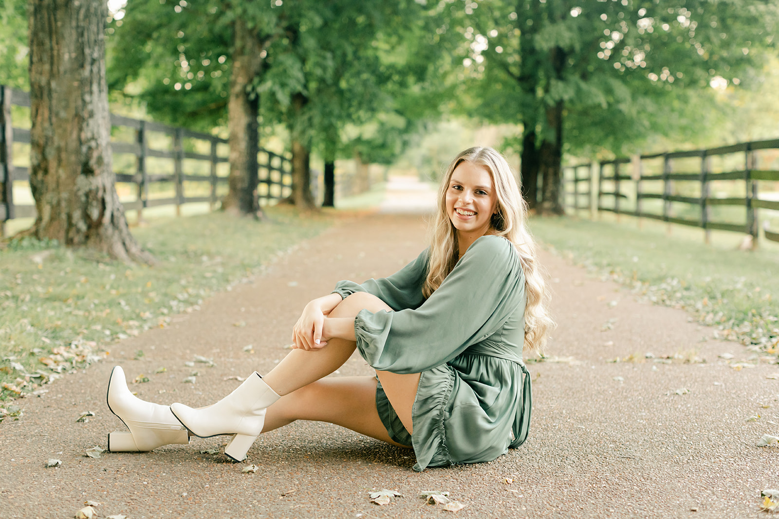 golden hour senior photos in tree lined path