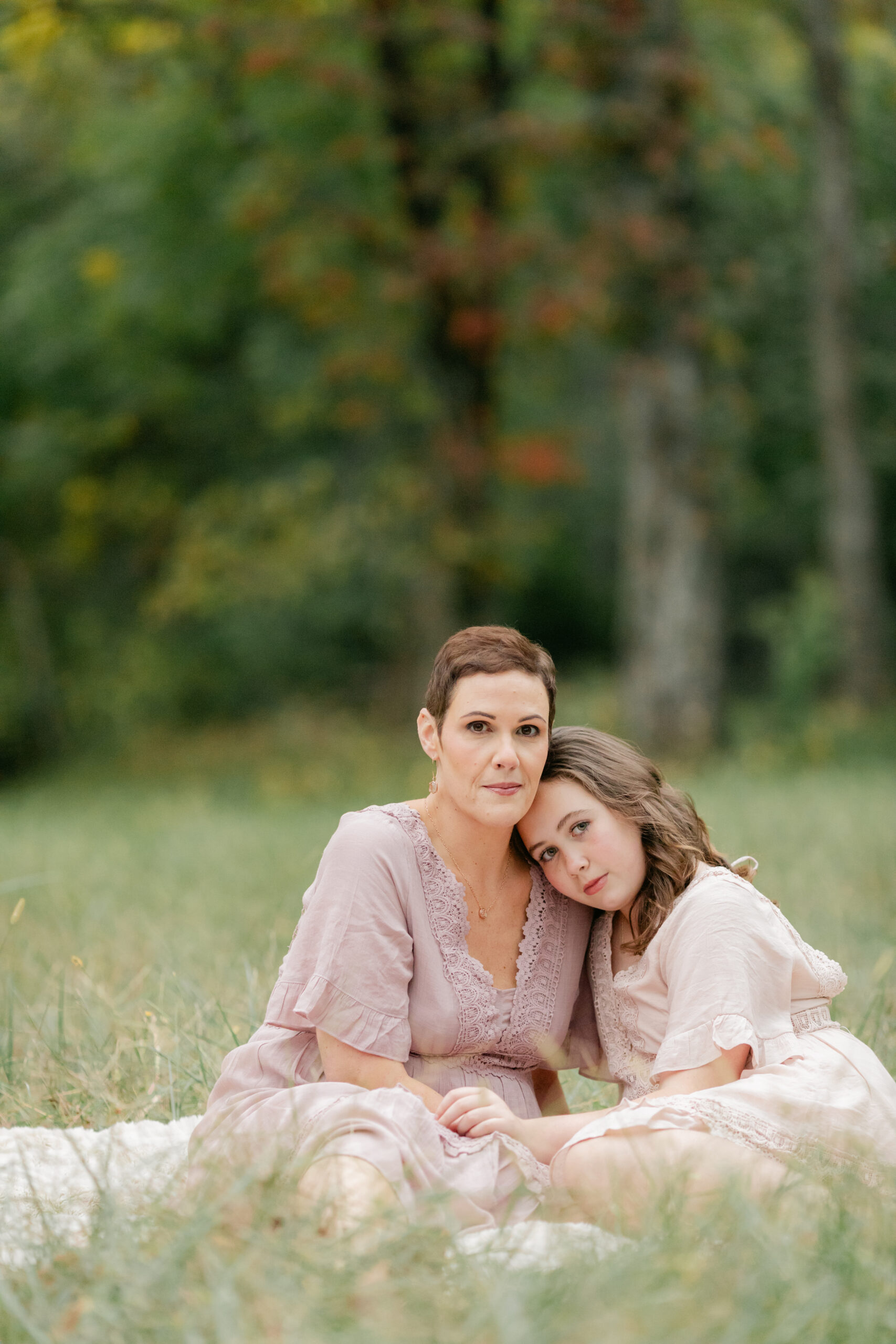 mother daughter during fall family photos at the woods