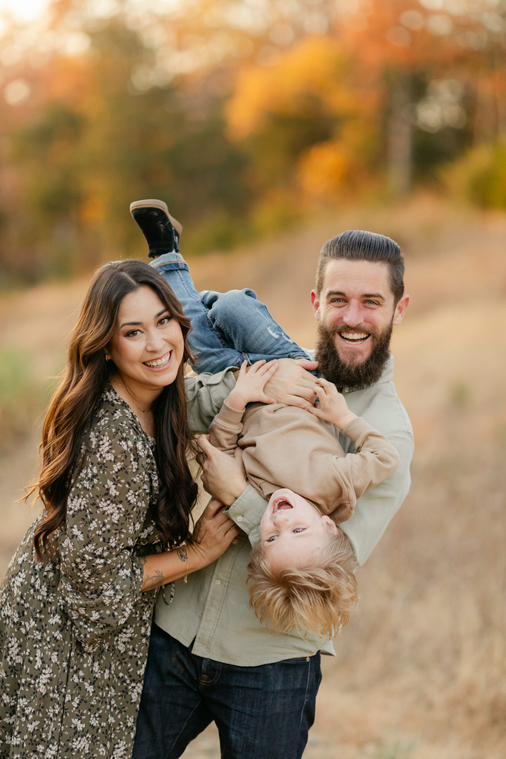 fall family photos at top of hill.