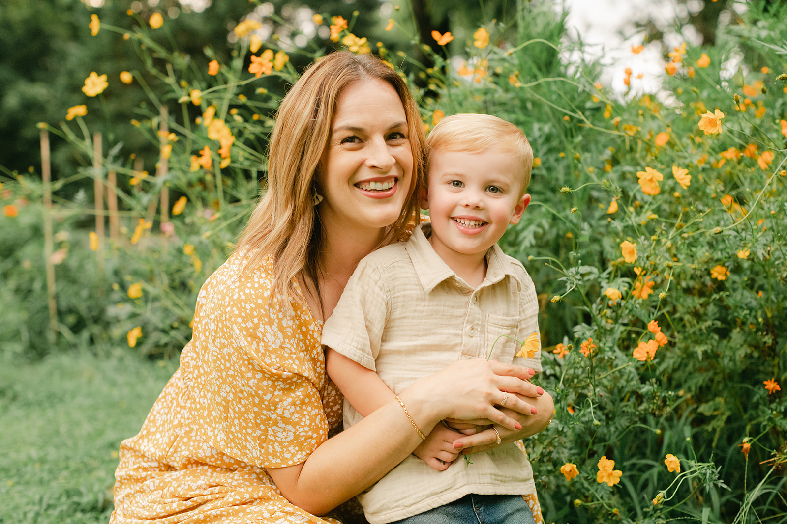 mama with toddler boy in garden during motherhood minis