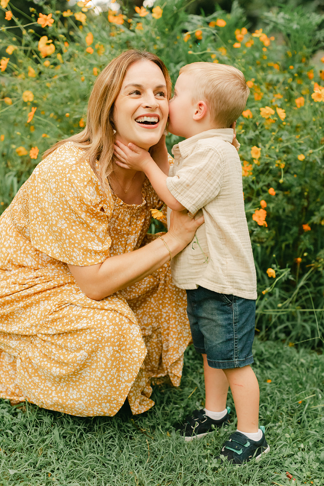 mama with toddler boy in garden during motherhood minis