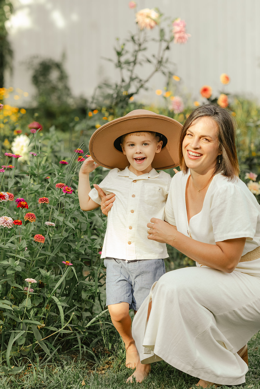 mama with toddler boy in garden during motherhood minis