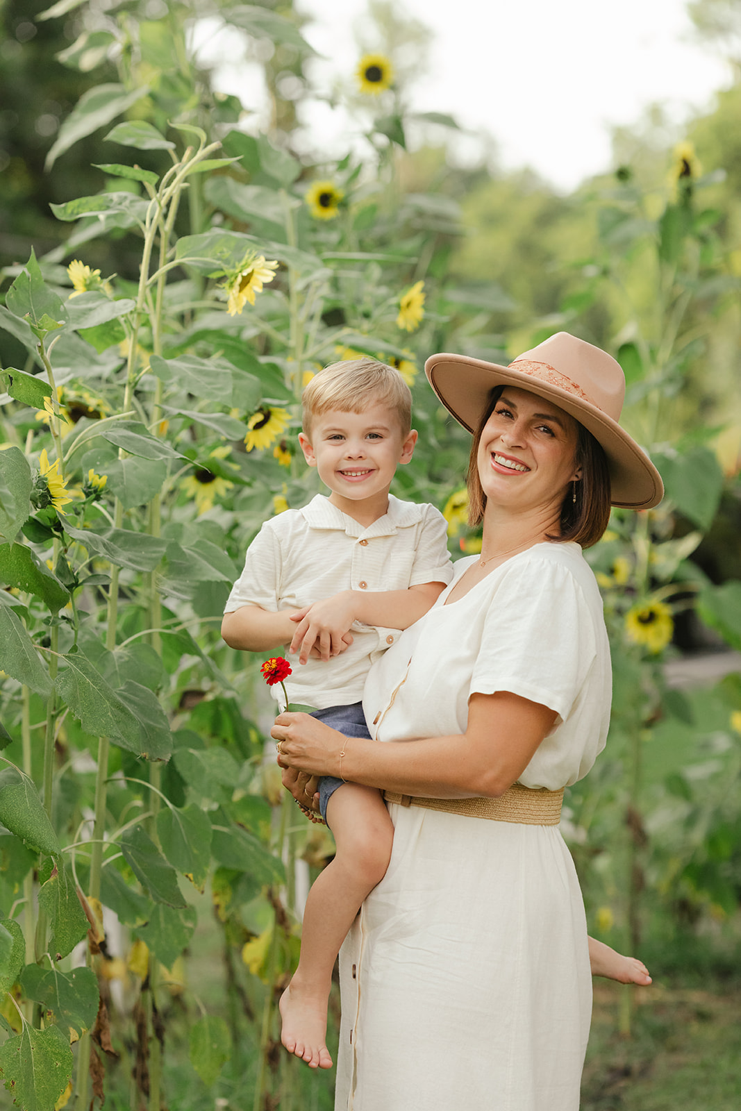 mama with toddler boy in garden during motherhood minis