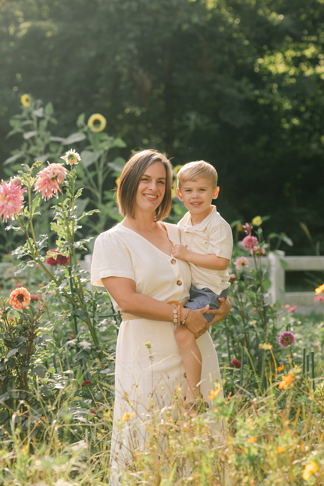 mama with toddler boy in garden during motherhood minis