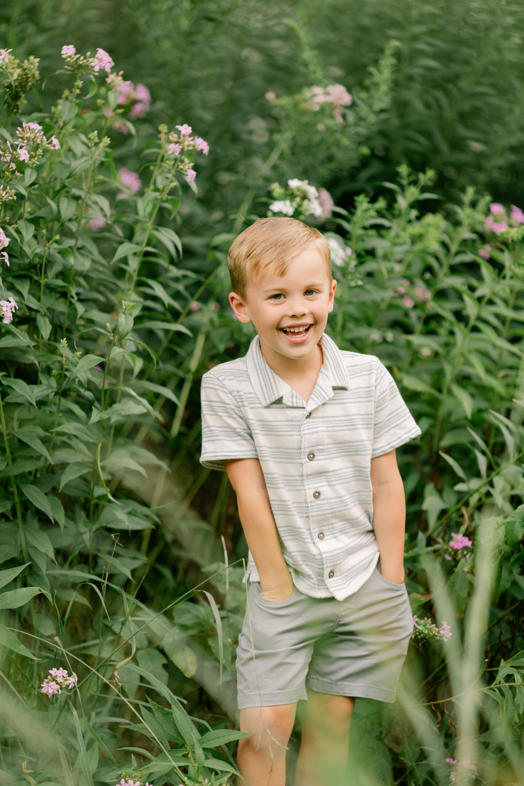 toddler boy smiling in the garden