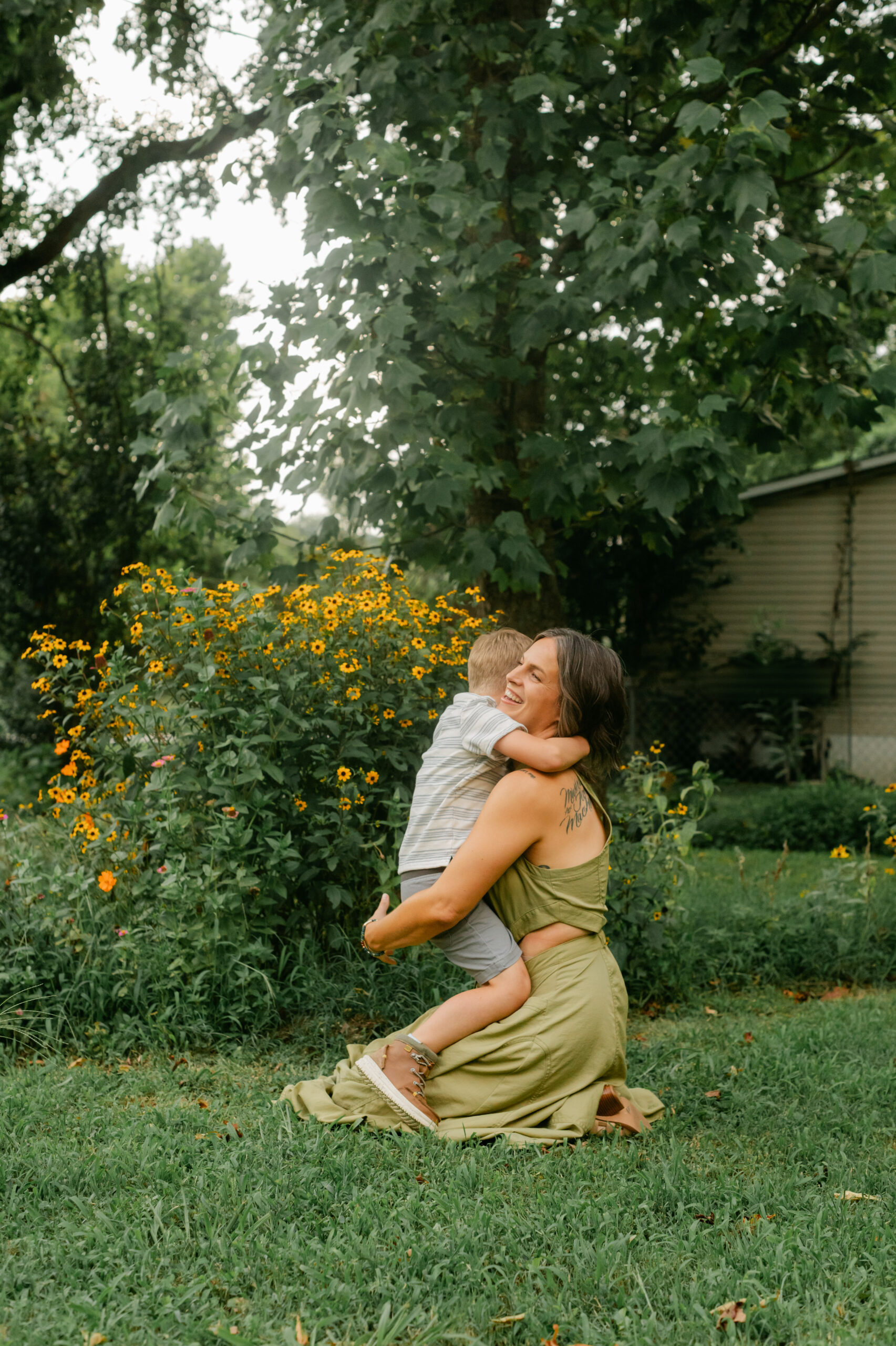 mama with her toddler boy in the garden during motherhood minis