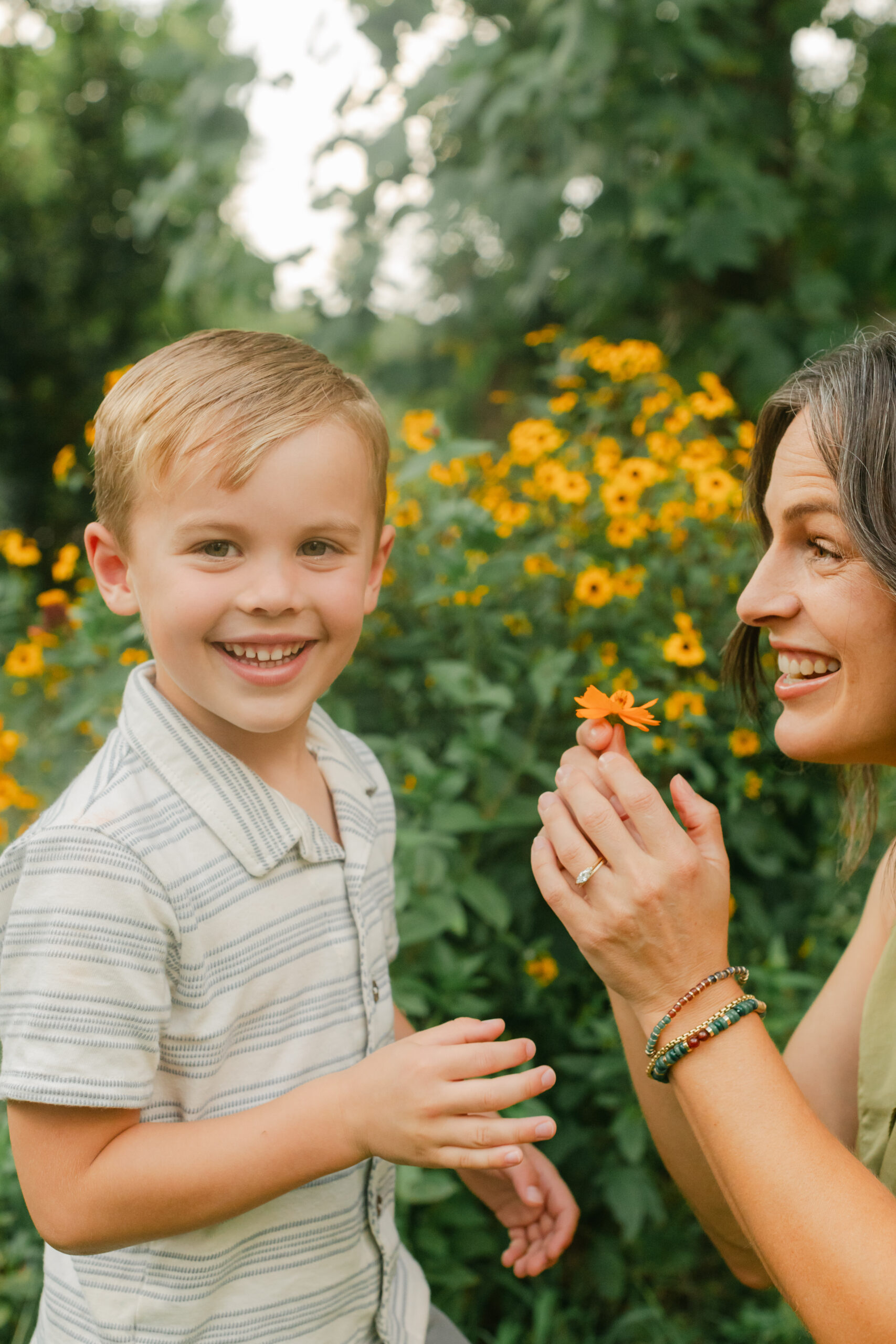 mama with her toddler boy in the garden during motherhood minis