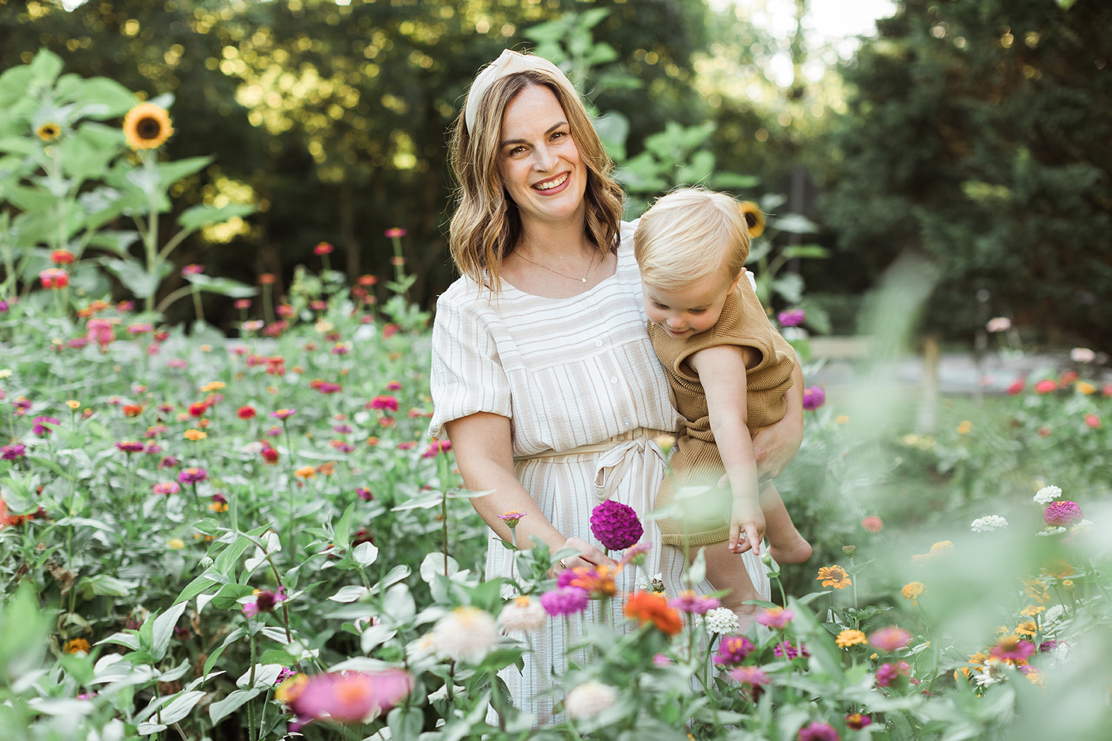 mama with baby boy in the garden during motherhood minis