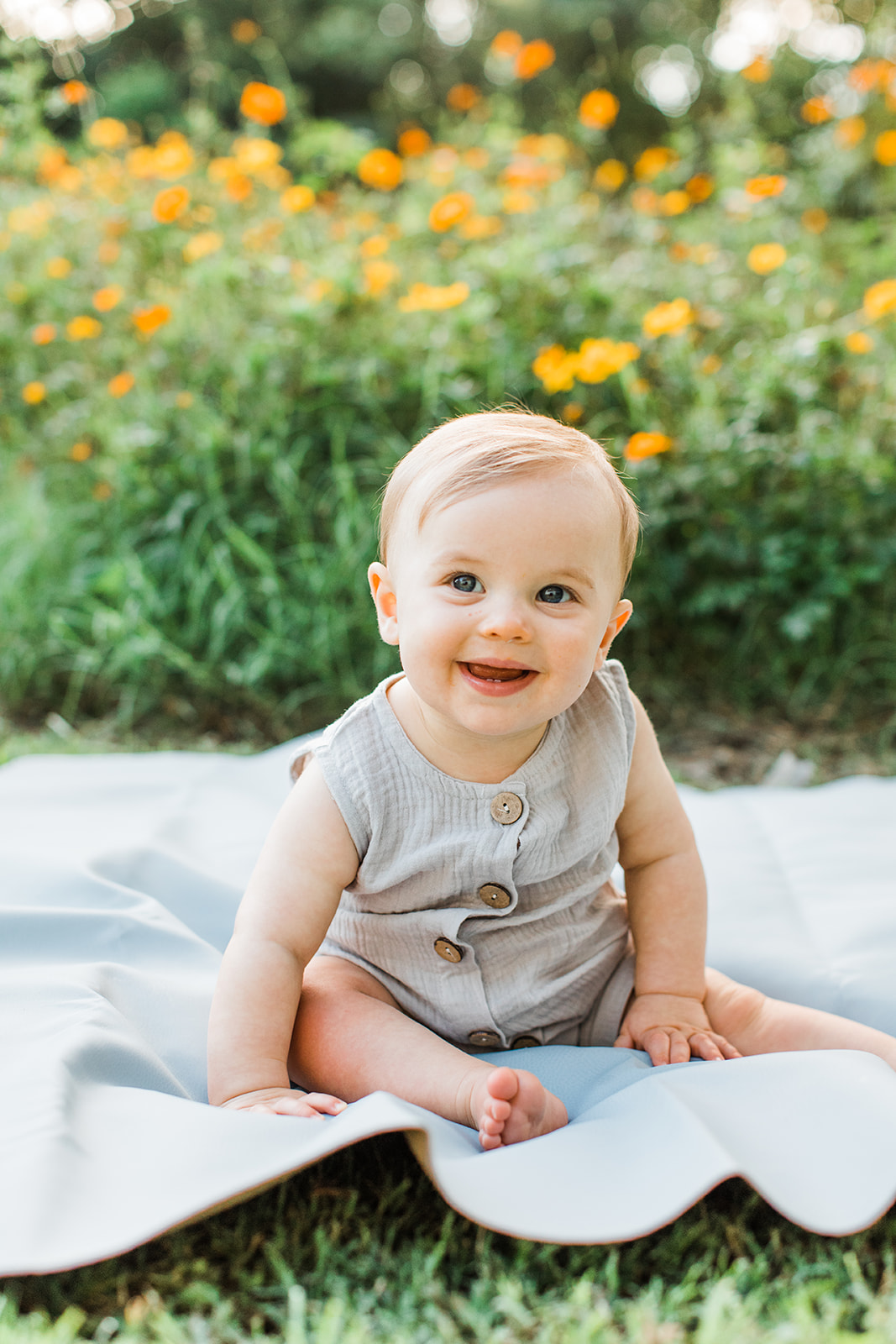 baby boy in the garden during motherhood minis