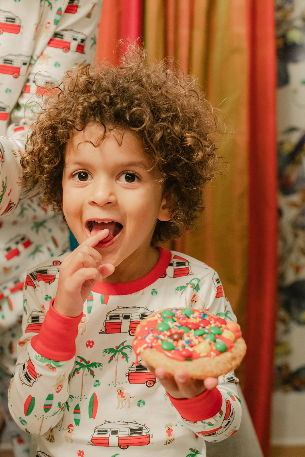 kids in Christmas pj's baking cookies. Christmas family photos in home