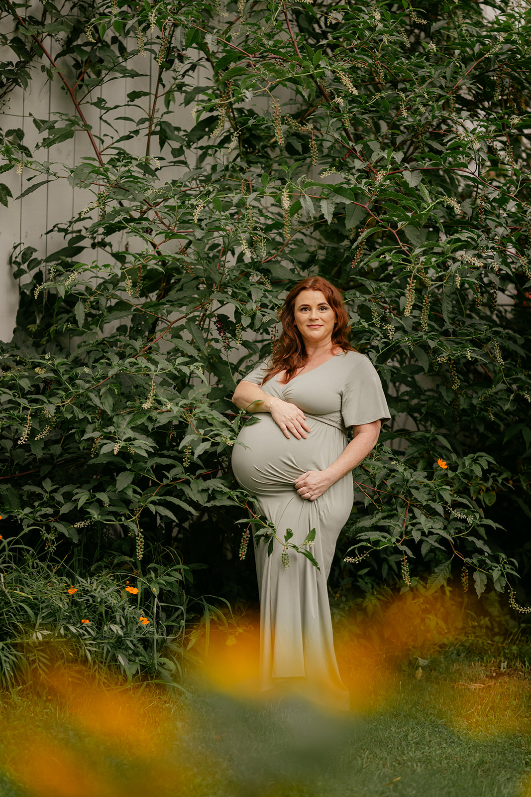 pregnant woman in flower garden. motherhood minis photo session in nashville