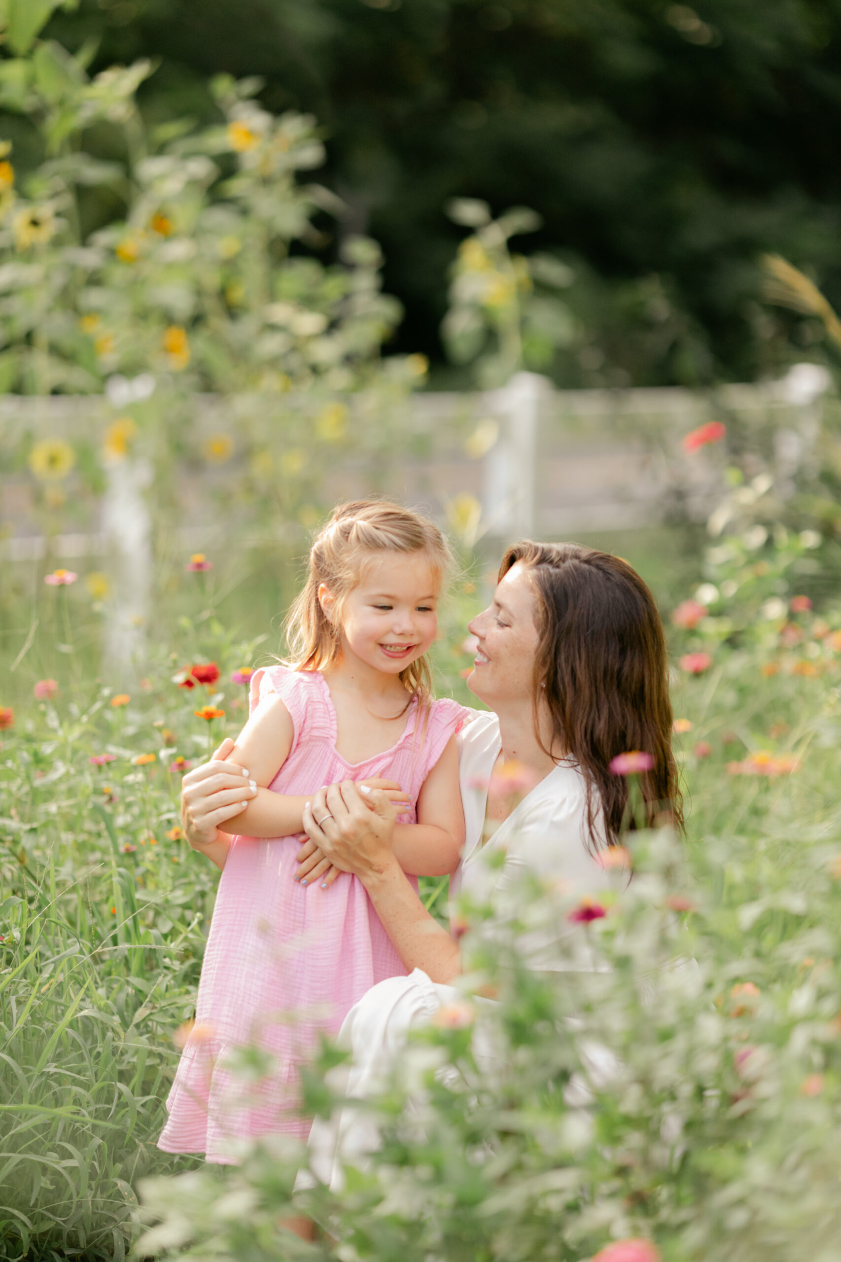 mama and young daughter in flower garden. motherhood minis photo session in nashville