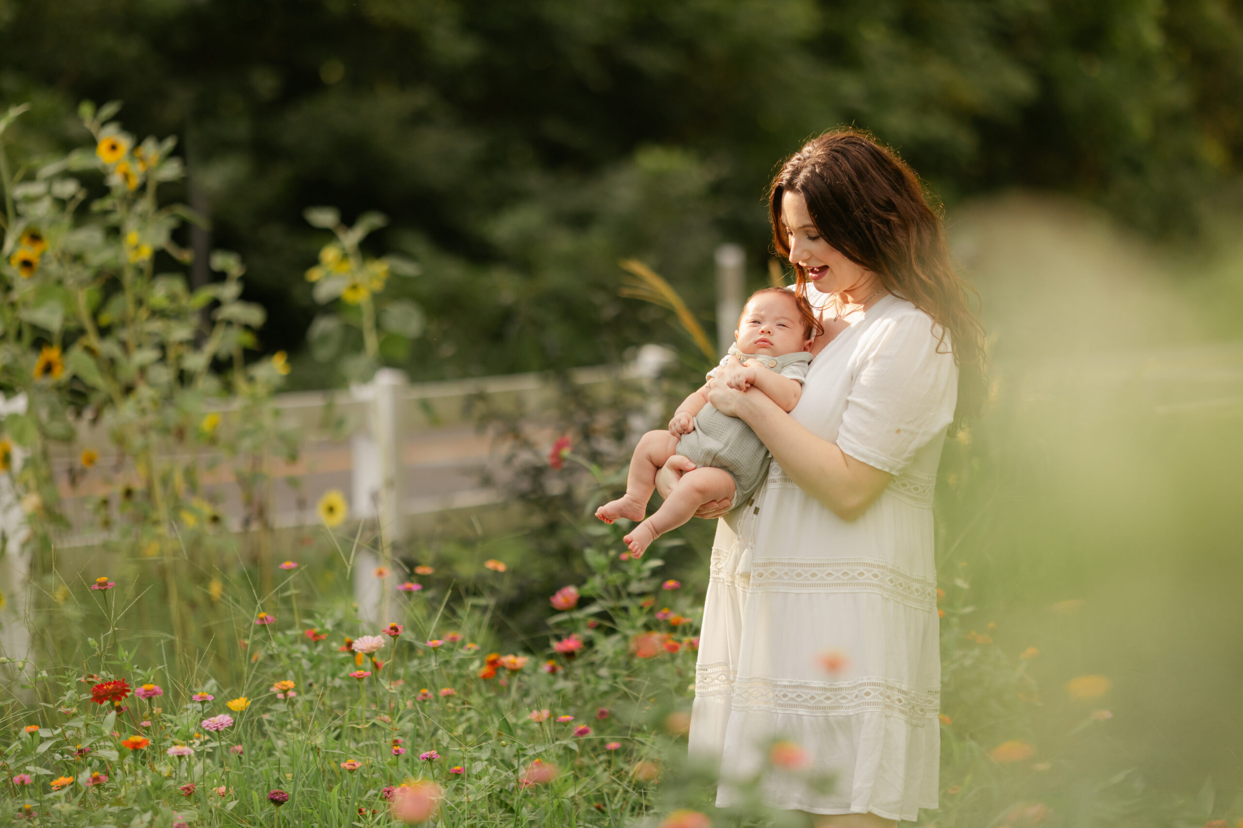 mama and baby boy in flower garden. motherhood minis photo session in nashville