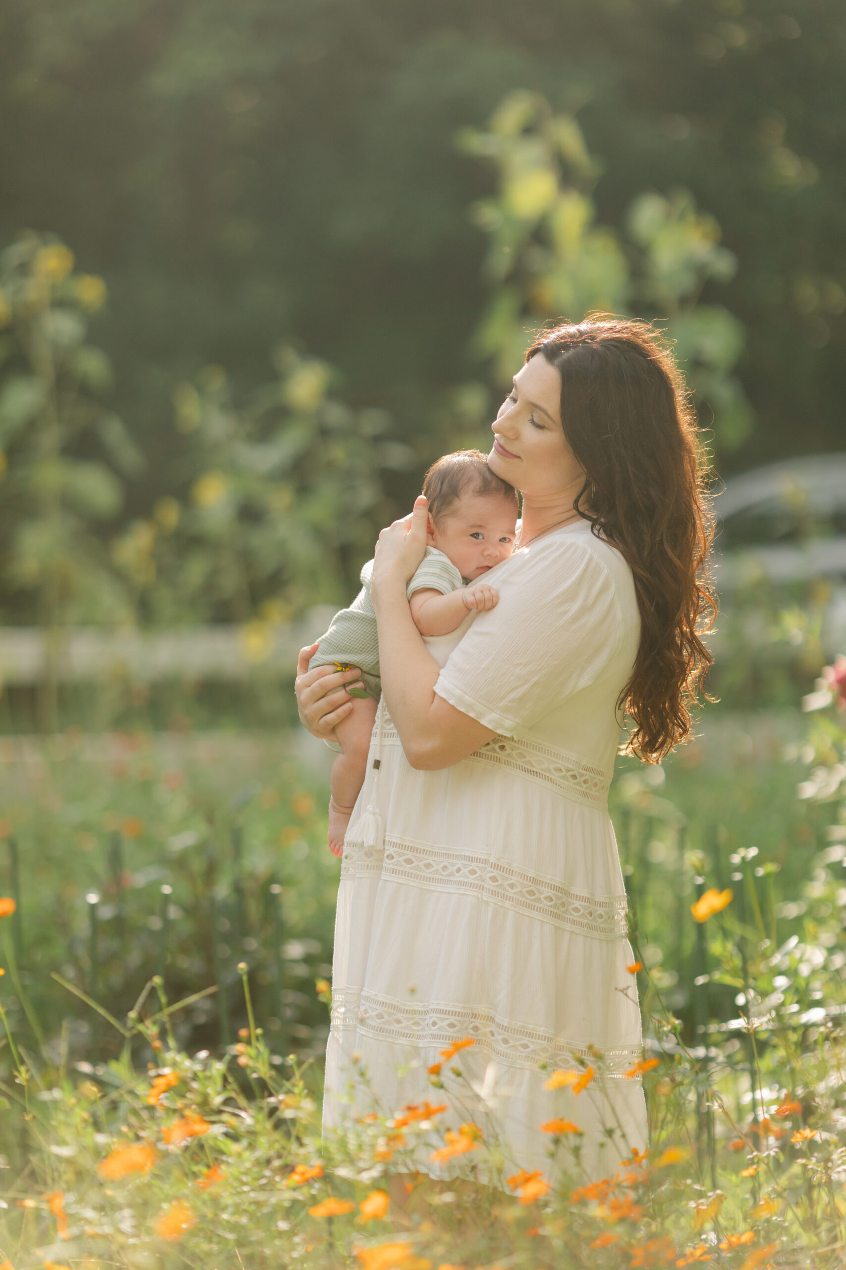 mama and baby boy in flower garden. motherhood minis photo session in nashville