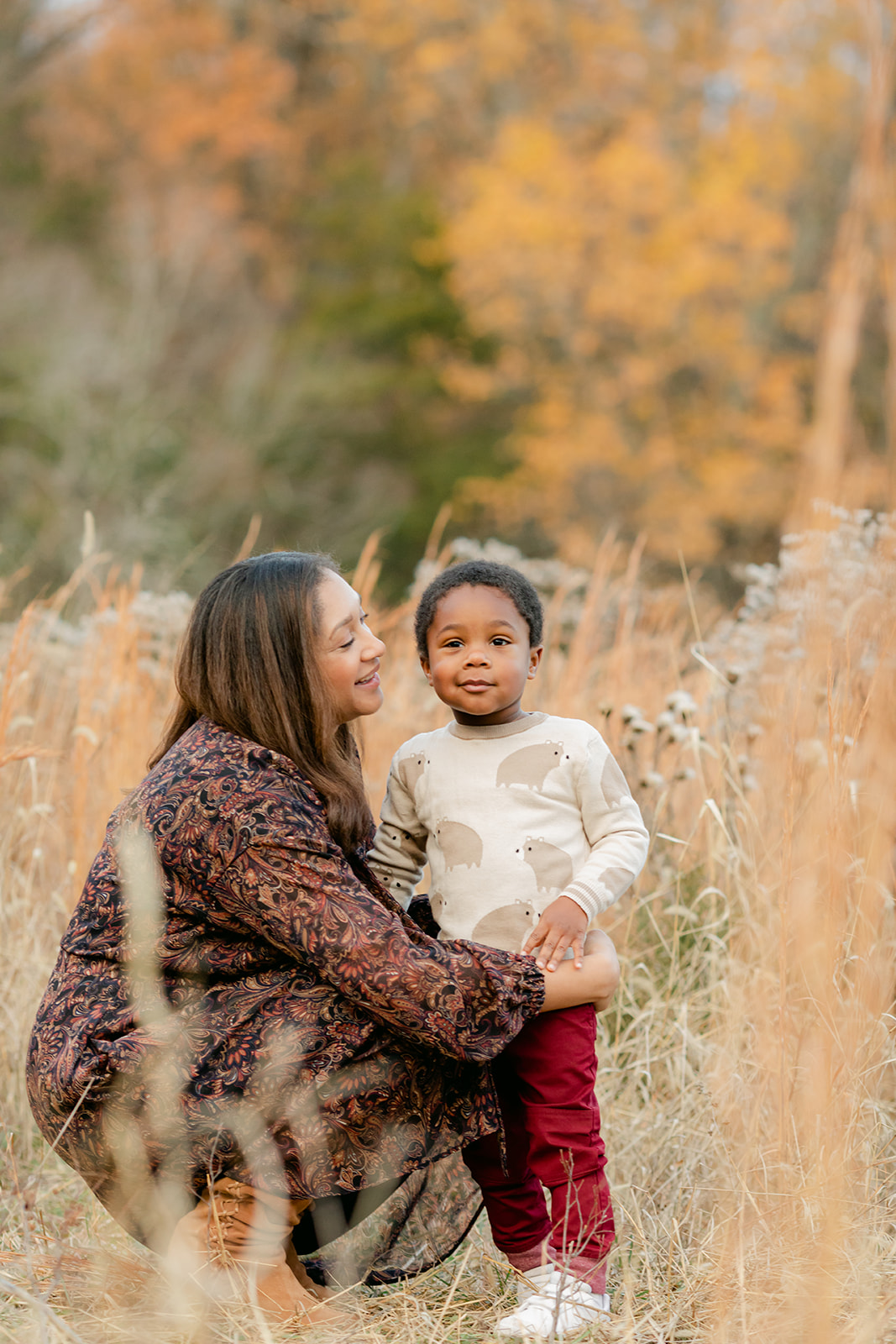 mom and son in a golden field