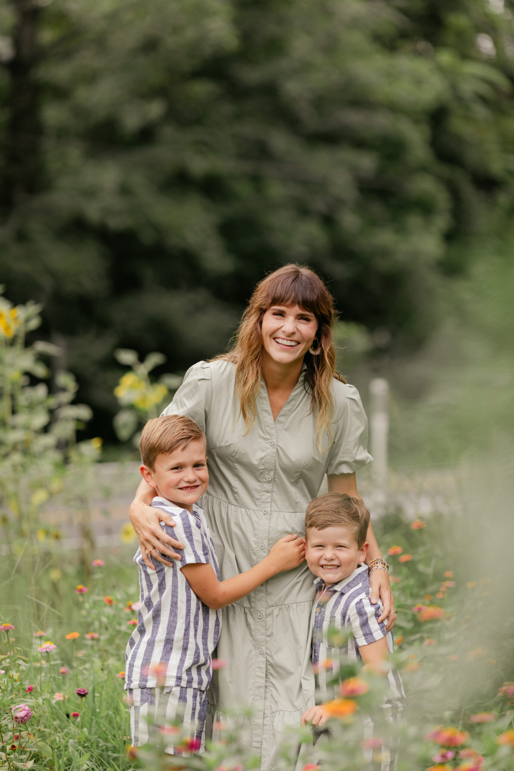 mama and her two boys and in flower garden. motherhood minis photo session in nashville