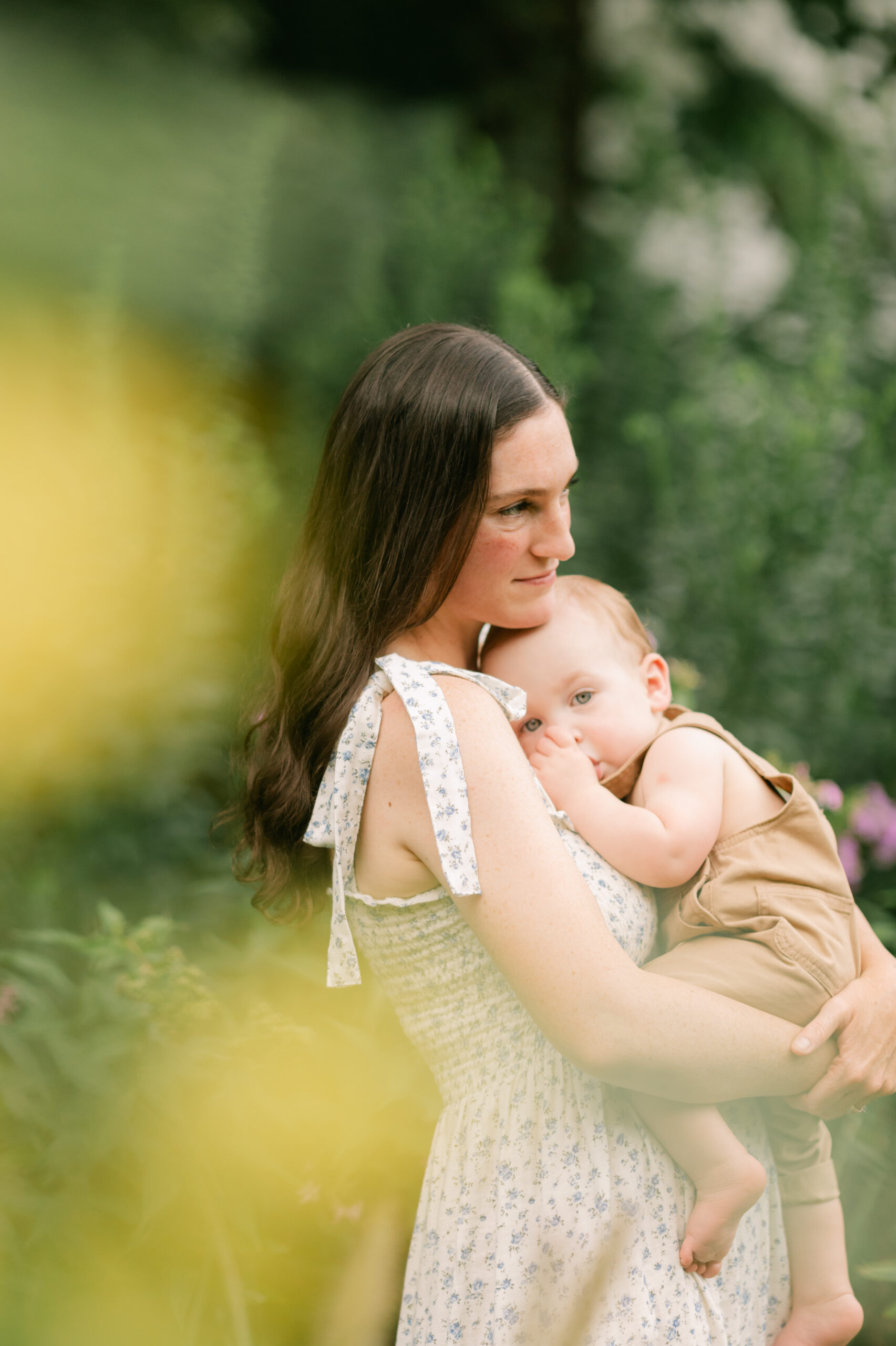 mama and baby boy in flower garden. motherhood minis photo session in nashville