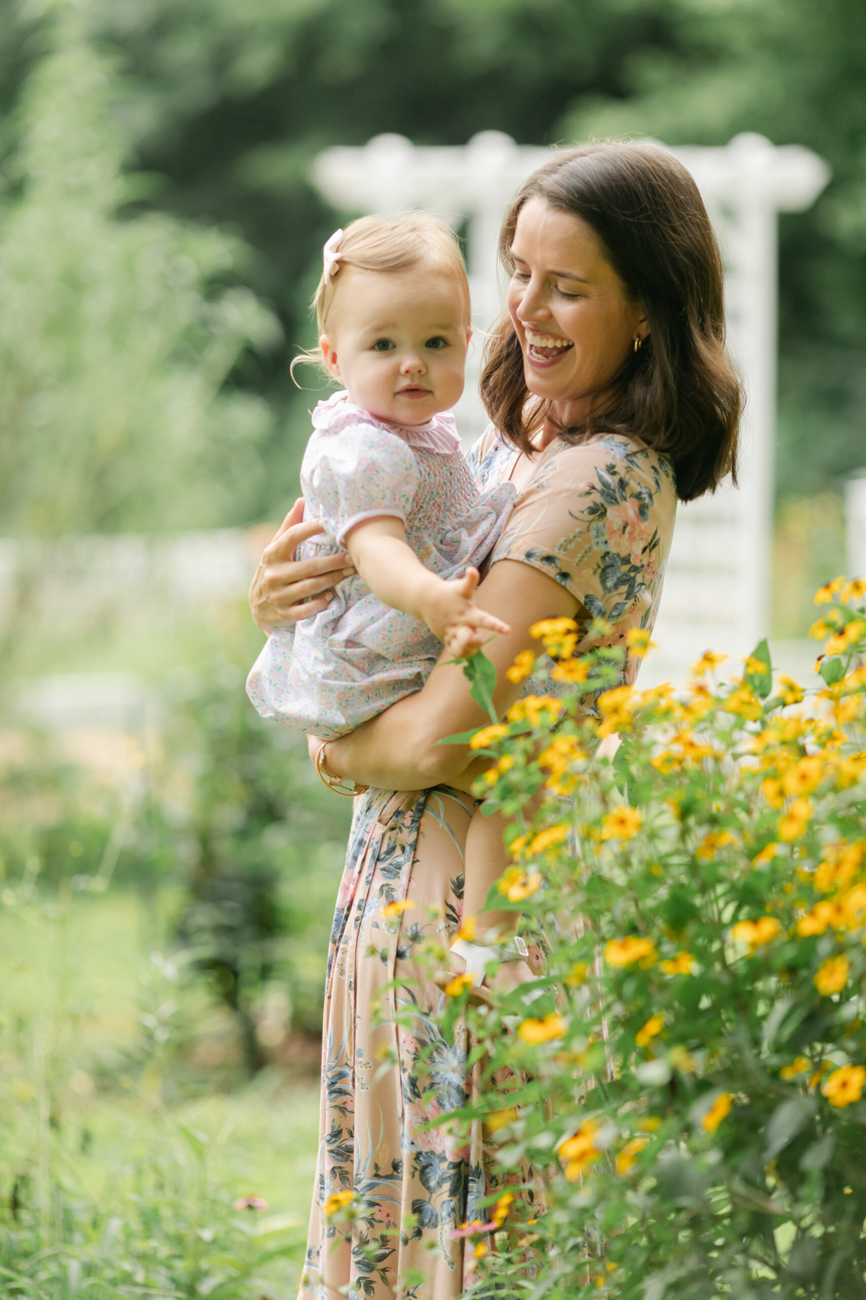 mama and baby girl in flower garden. motherhood minis photo session in nashville