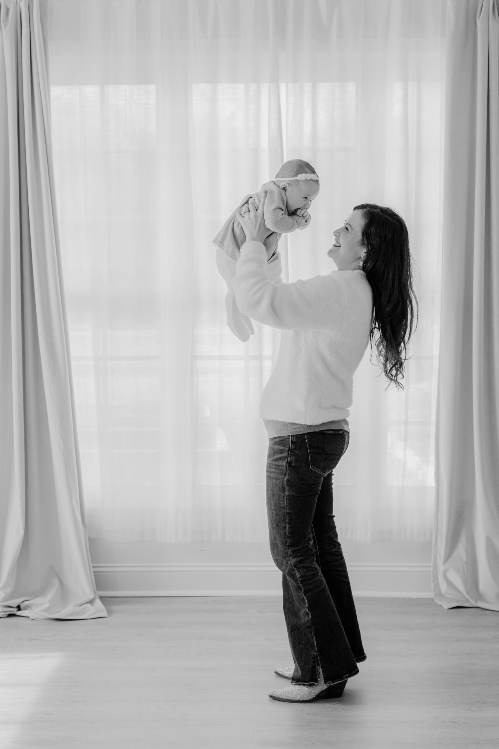 black and white photo of mama with 3 month old baby girl