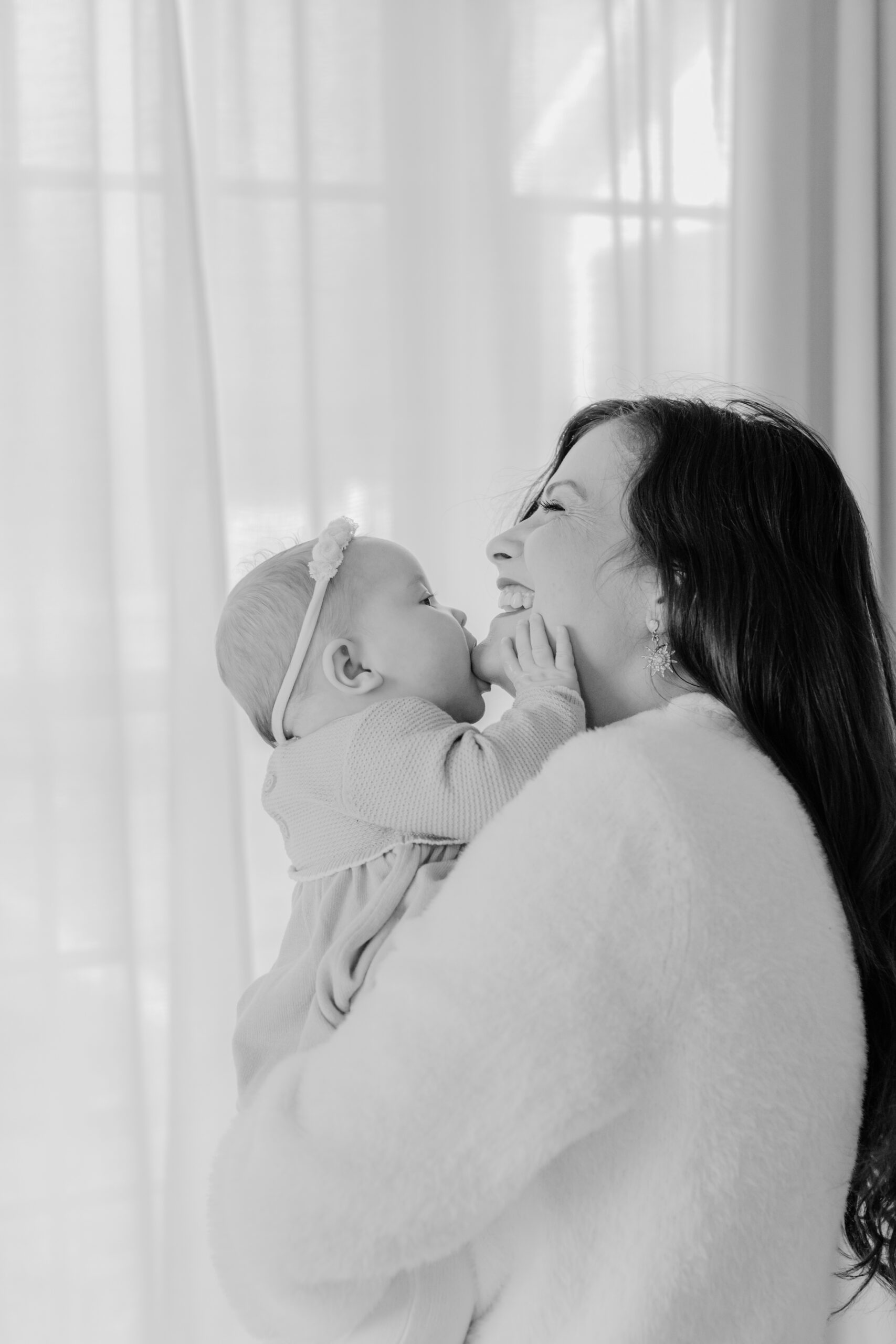 black and white photo of mama with 3 month old baby girl