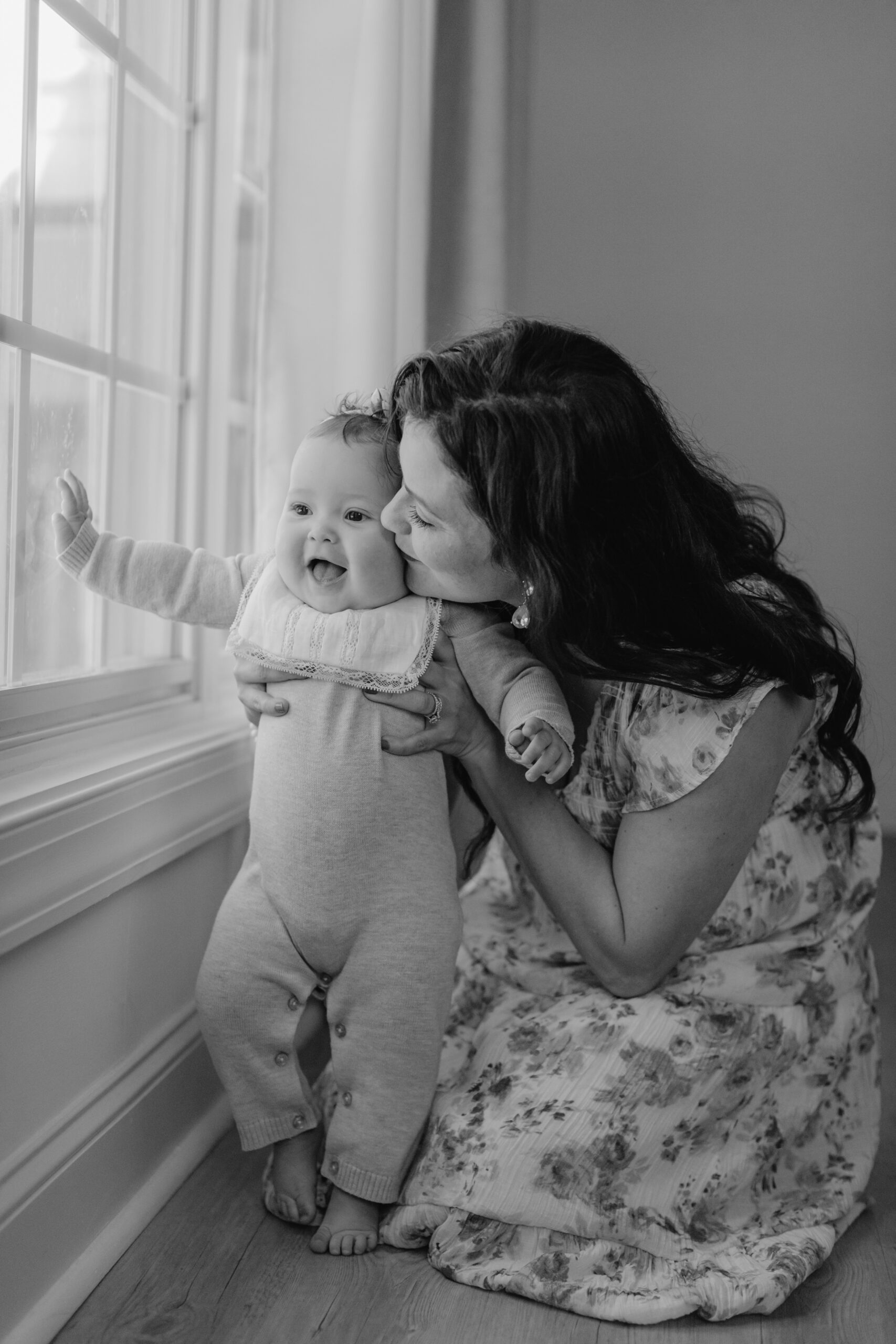 black and white photo of 6 month old baby girl with mama