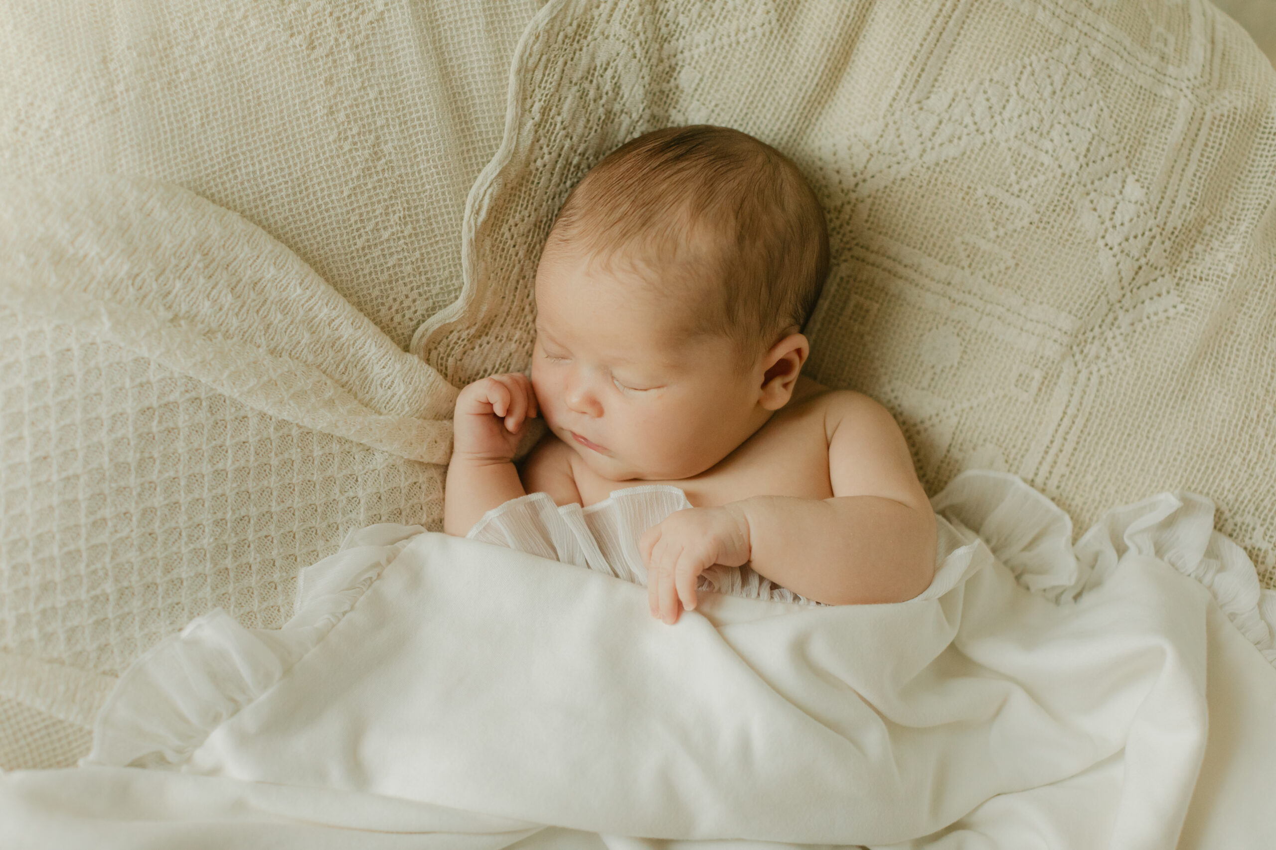 sleepy newborn baby girl