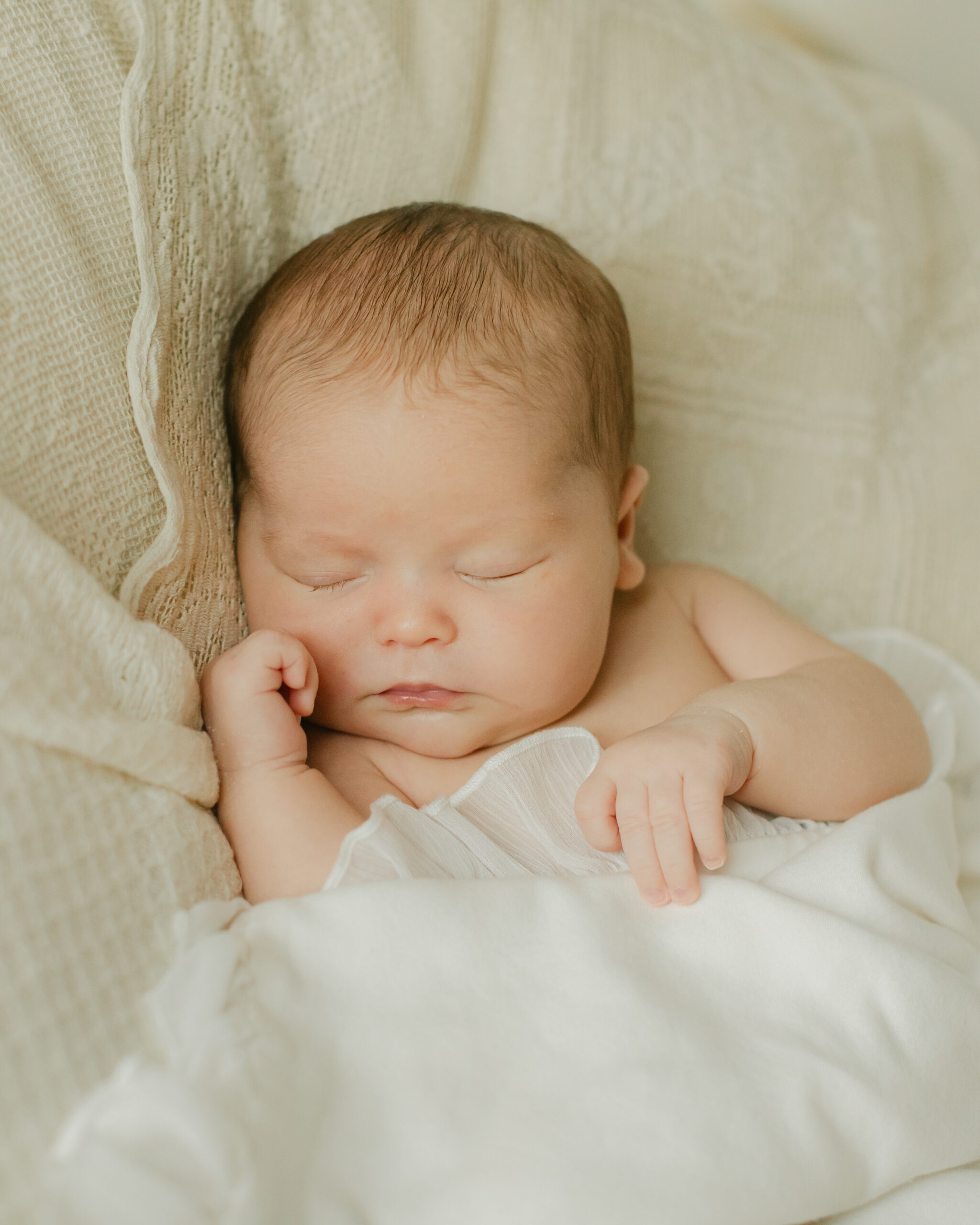 sleepy newborn baby girl