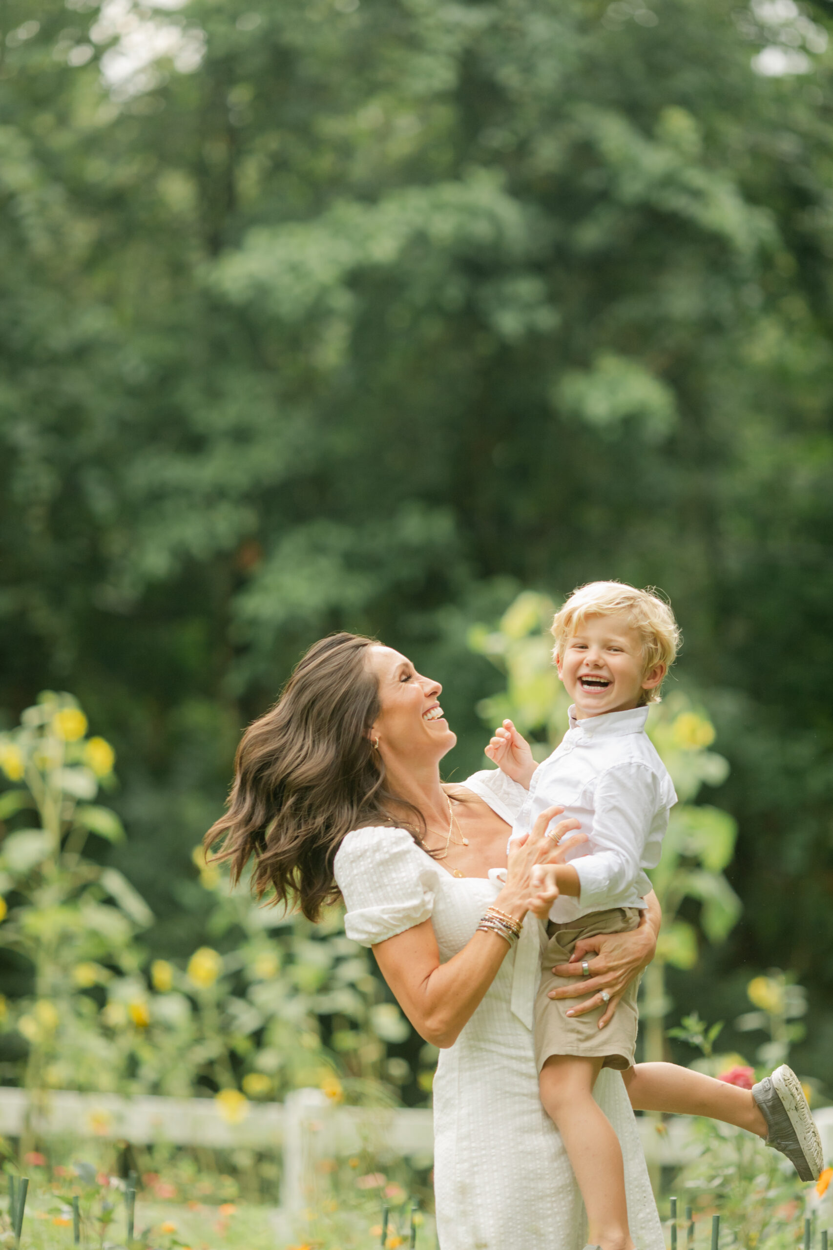 mama and toddler boy in flower garden. motherhood minis photo session in nashville