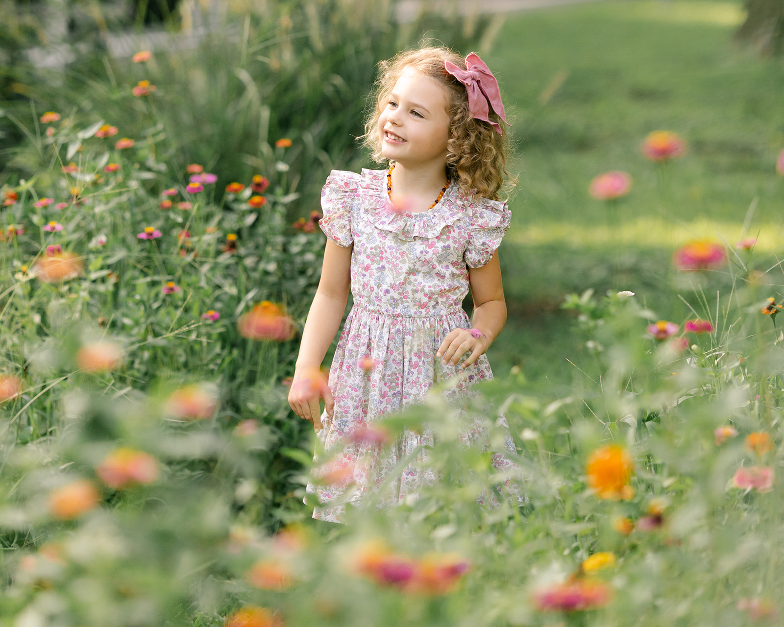 Young girl in flower garden. motherhood minis photo session in nashville