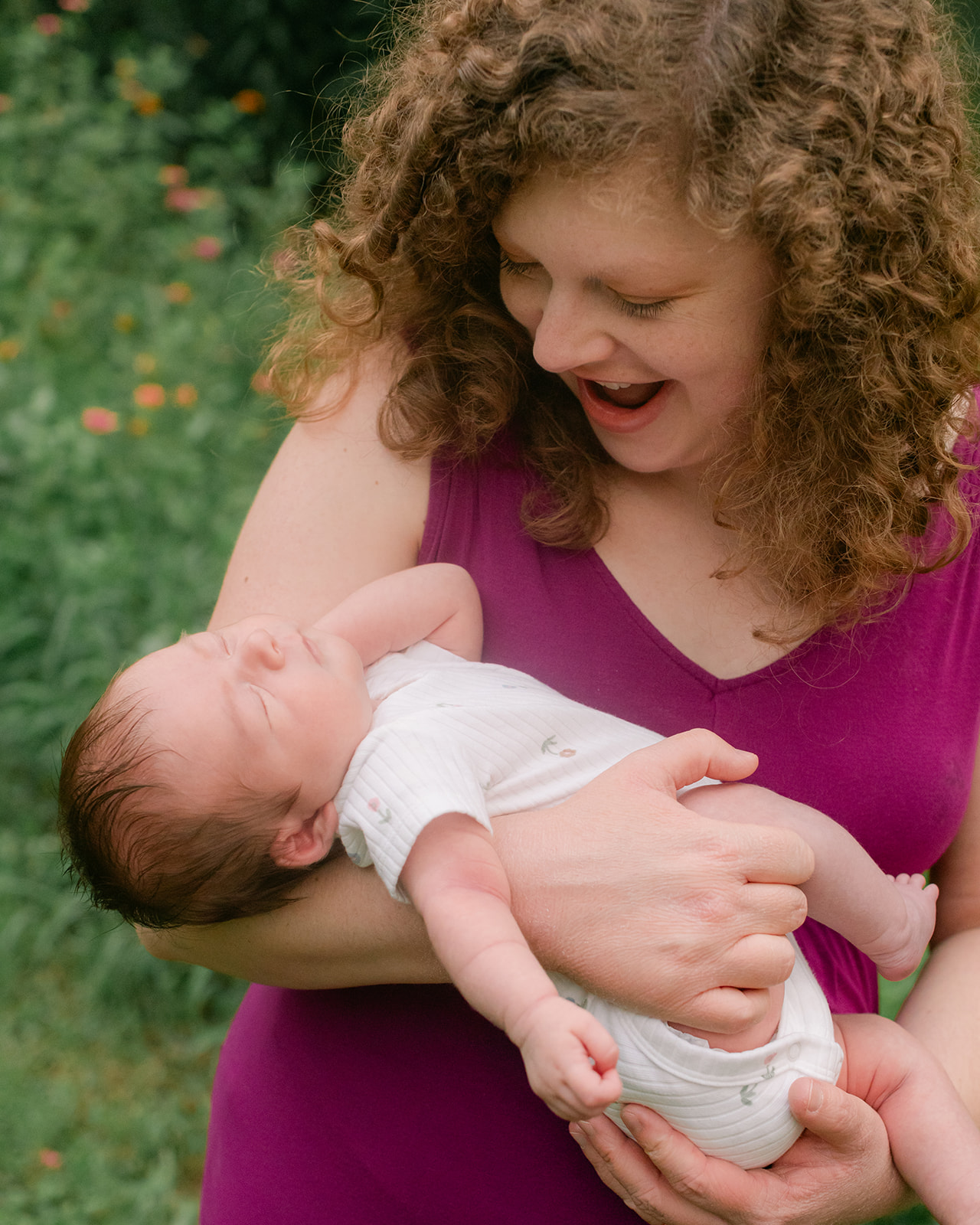 Woman holding newborn baby. motherhood minis photo session in nashville