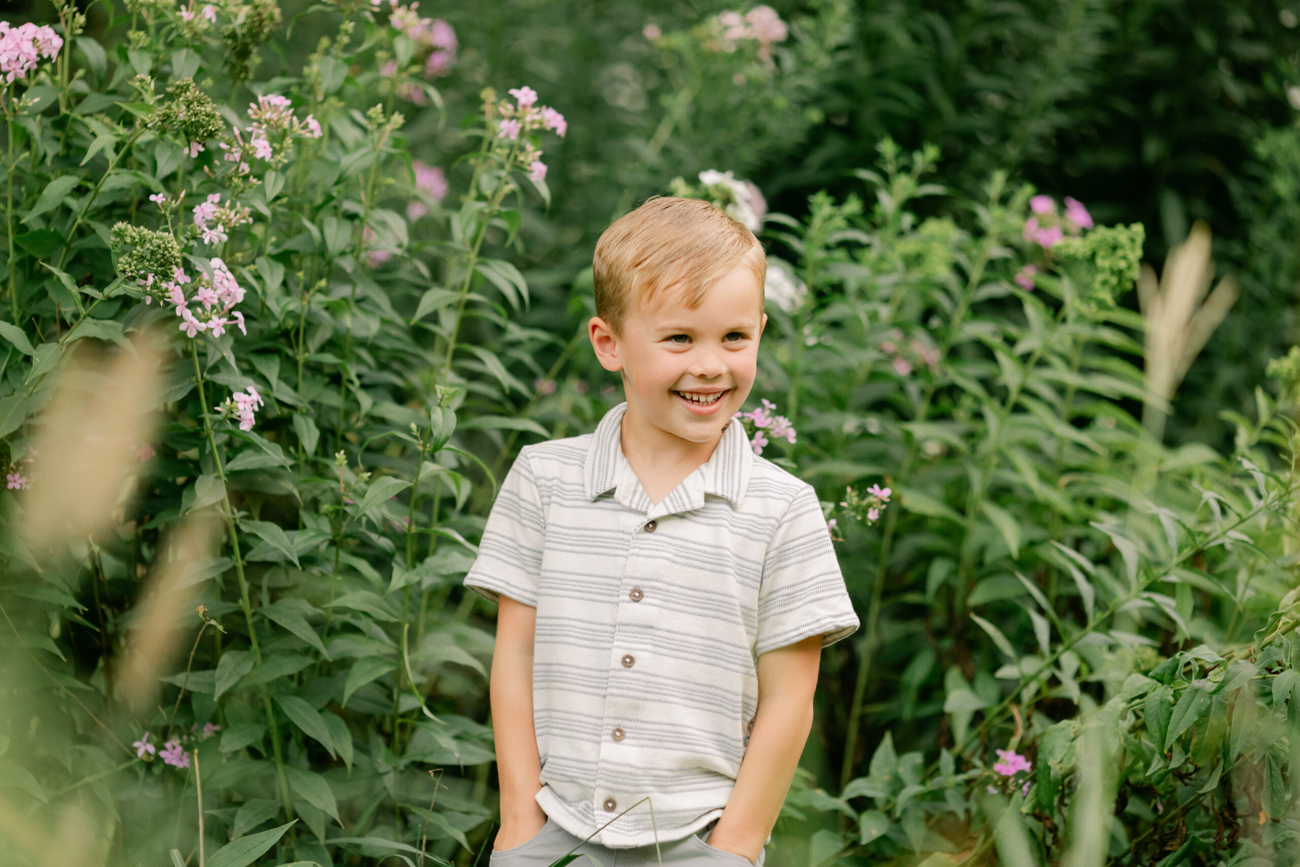 young boy in flower garden. motherhood minis photo session in nashville