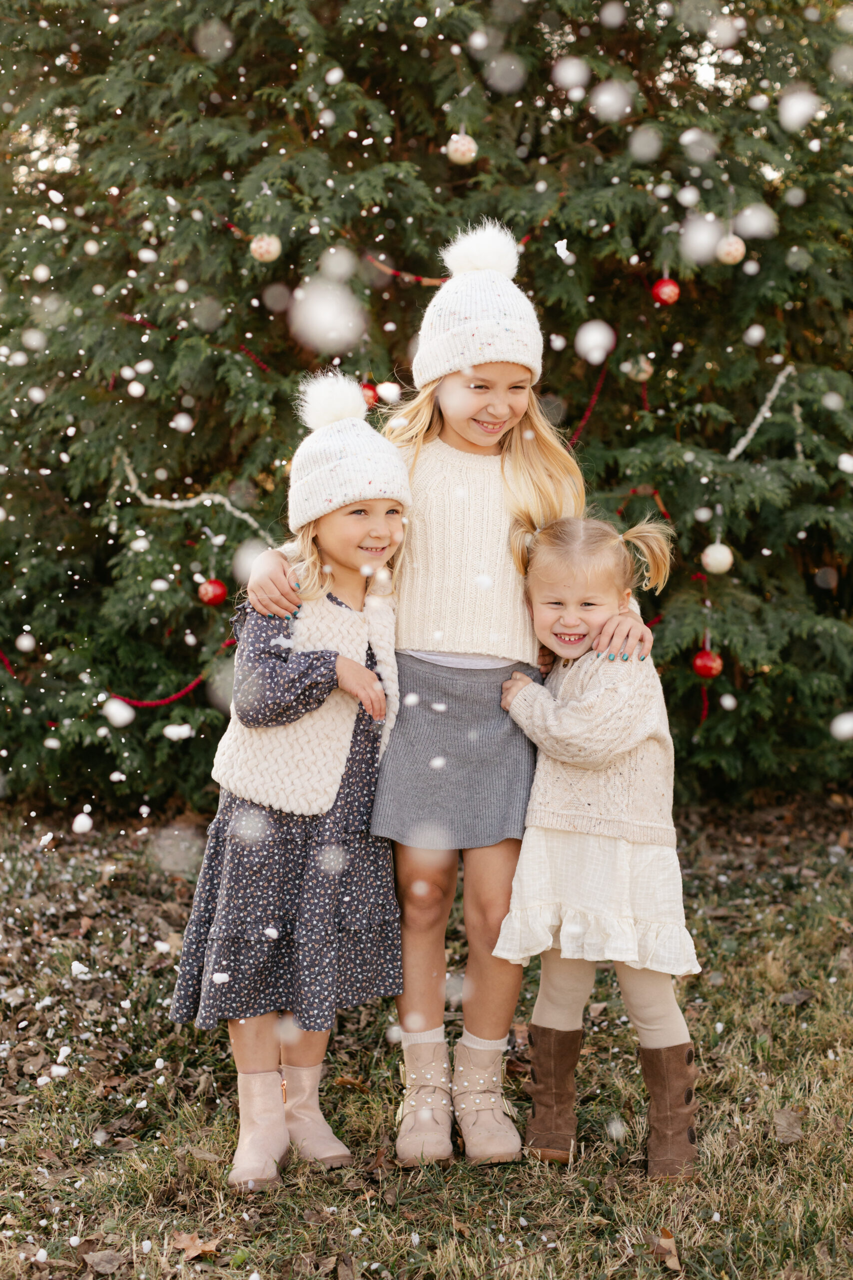 3 little sisters.  christmas themed family photos in tennessee with fake snow