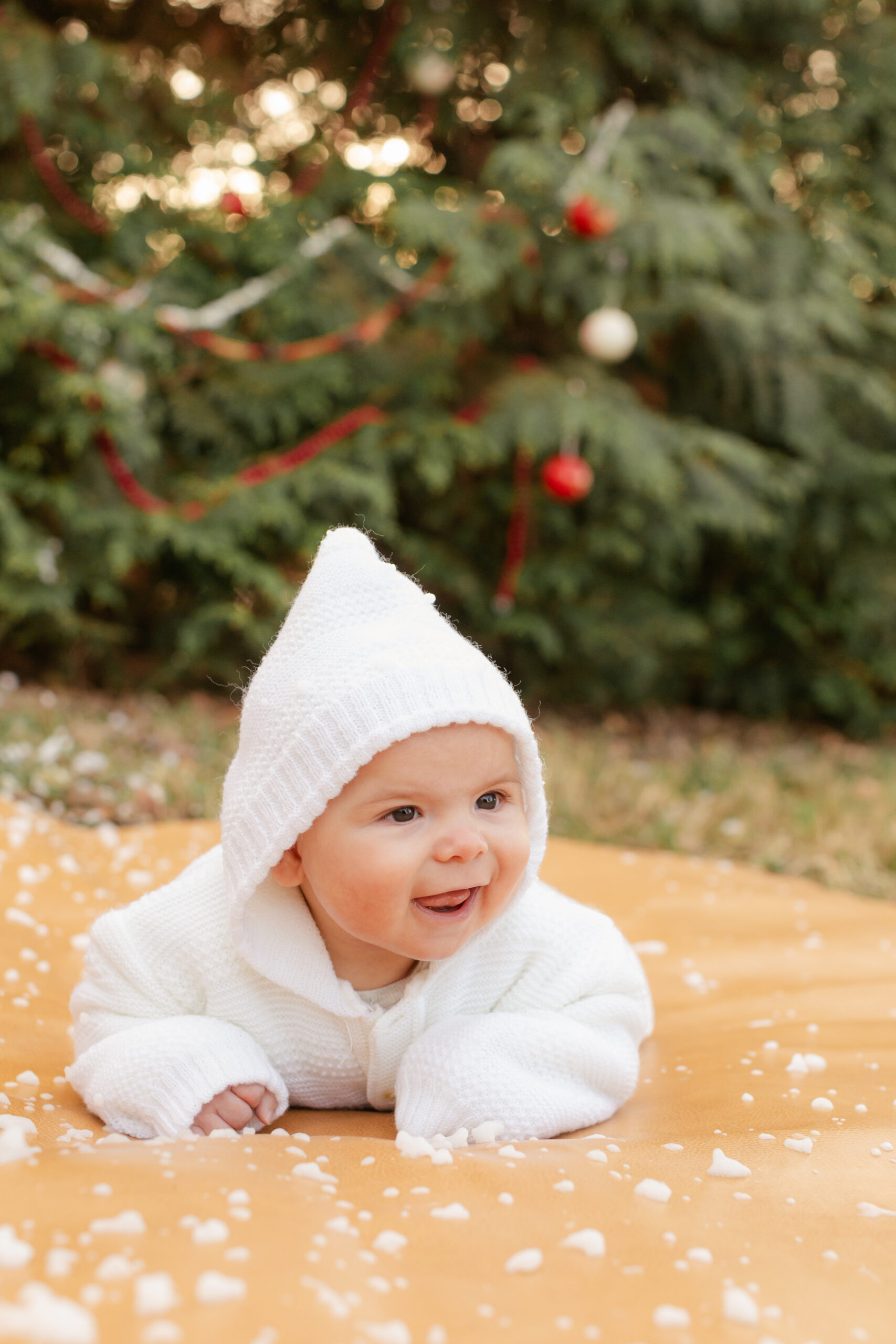 Baby boy.  christmas themed family photos in tennessee with fake snow