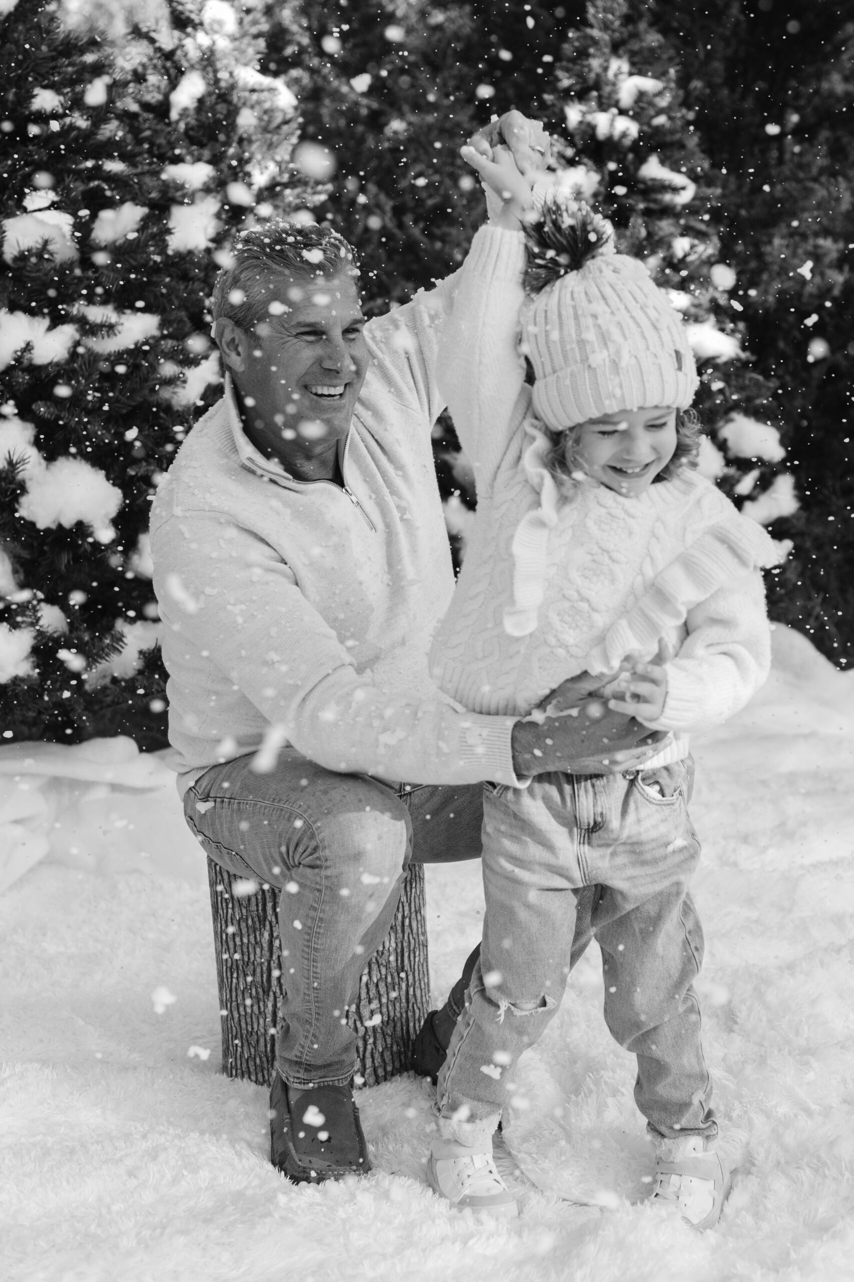 dad and daughter during snow minis christmas family photos