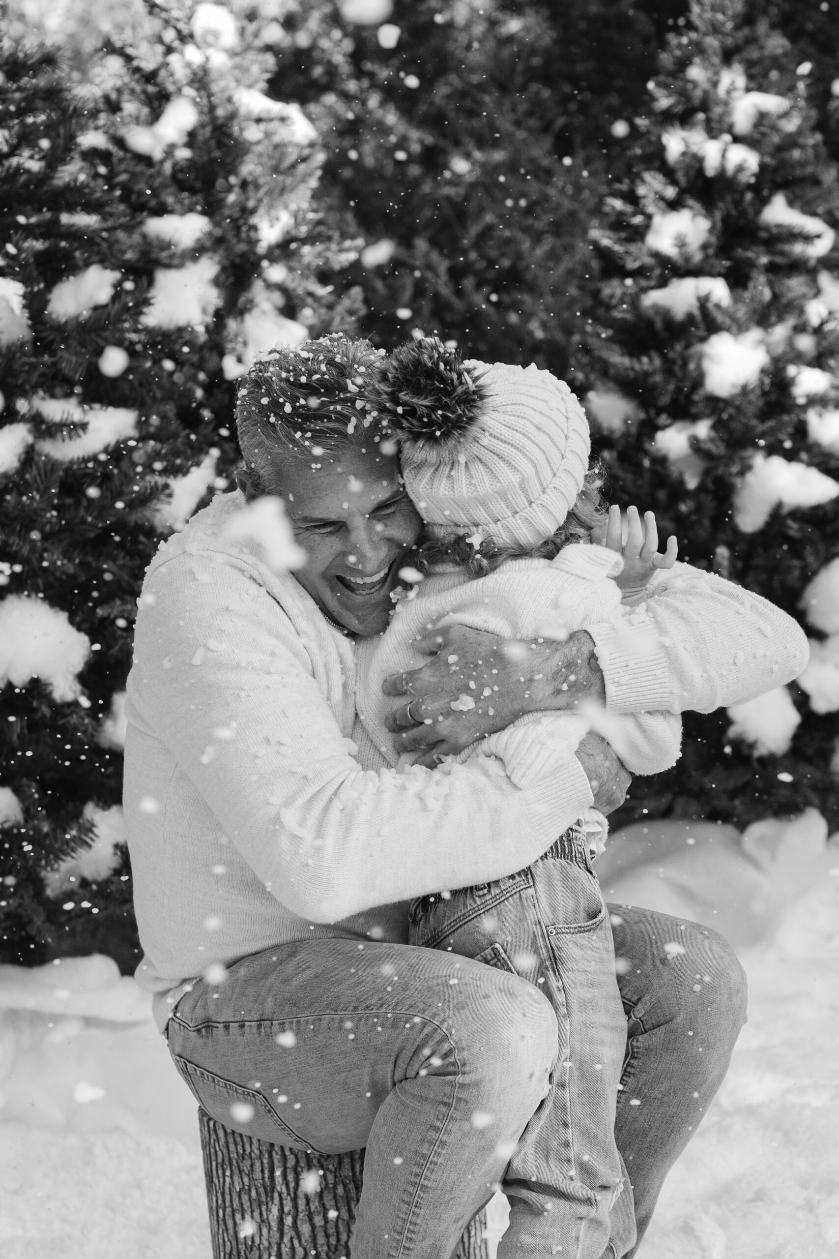 dad and daughter during snow minis christmas family photos