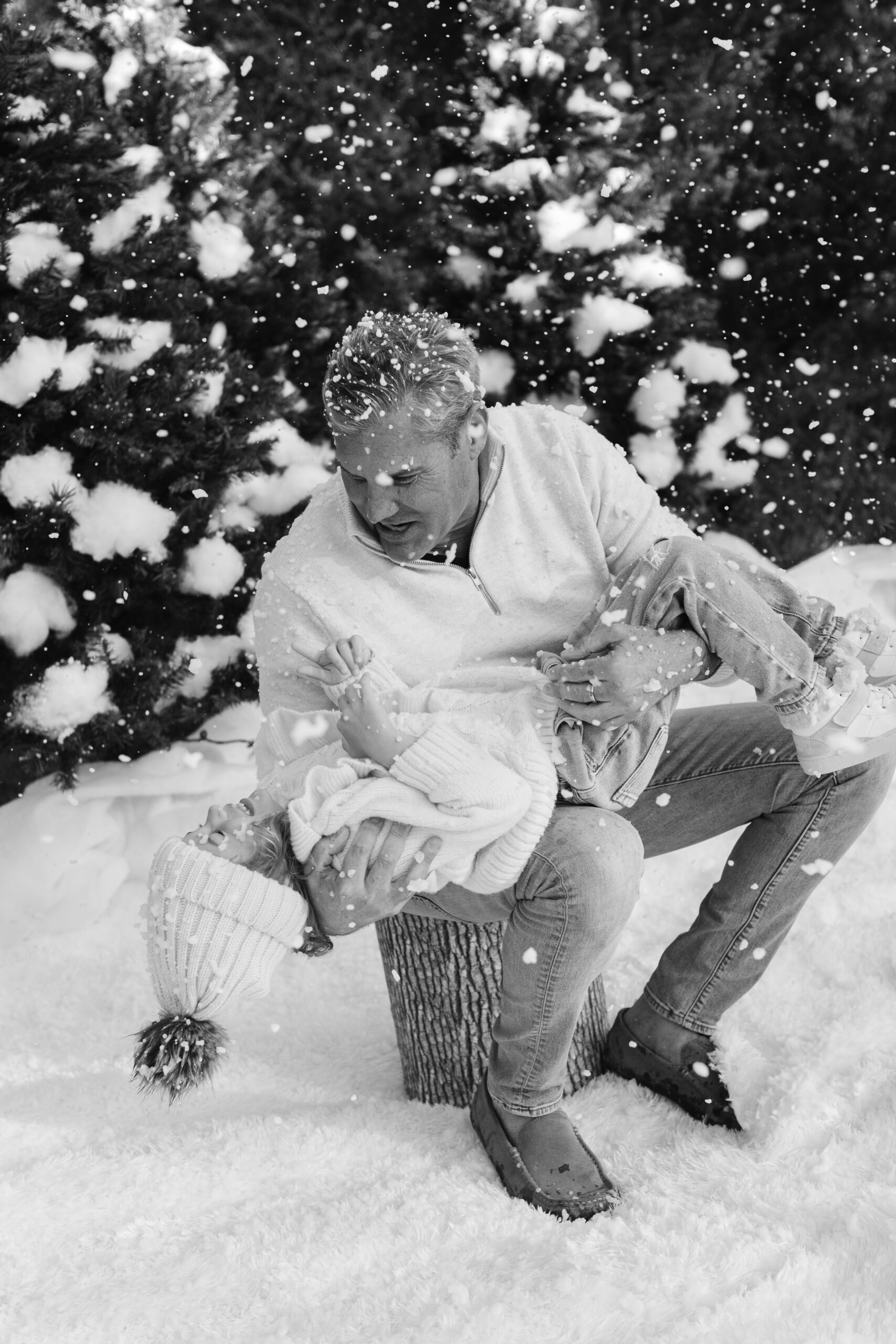 dad and daughter during snow minis christmas family photos