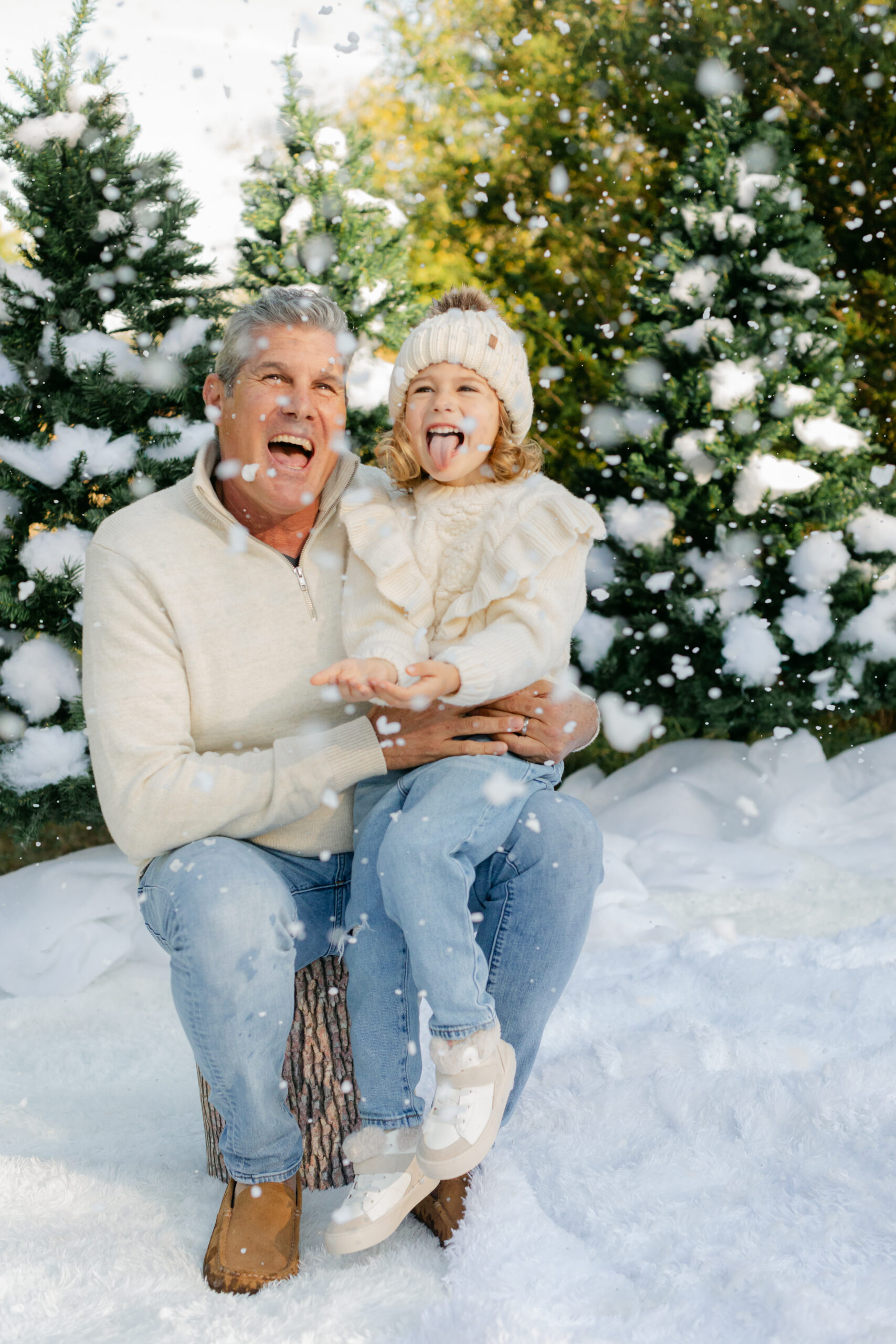 mom and daughter during snow minis christmas family photos