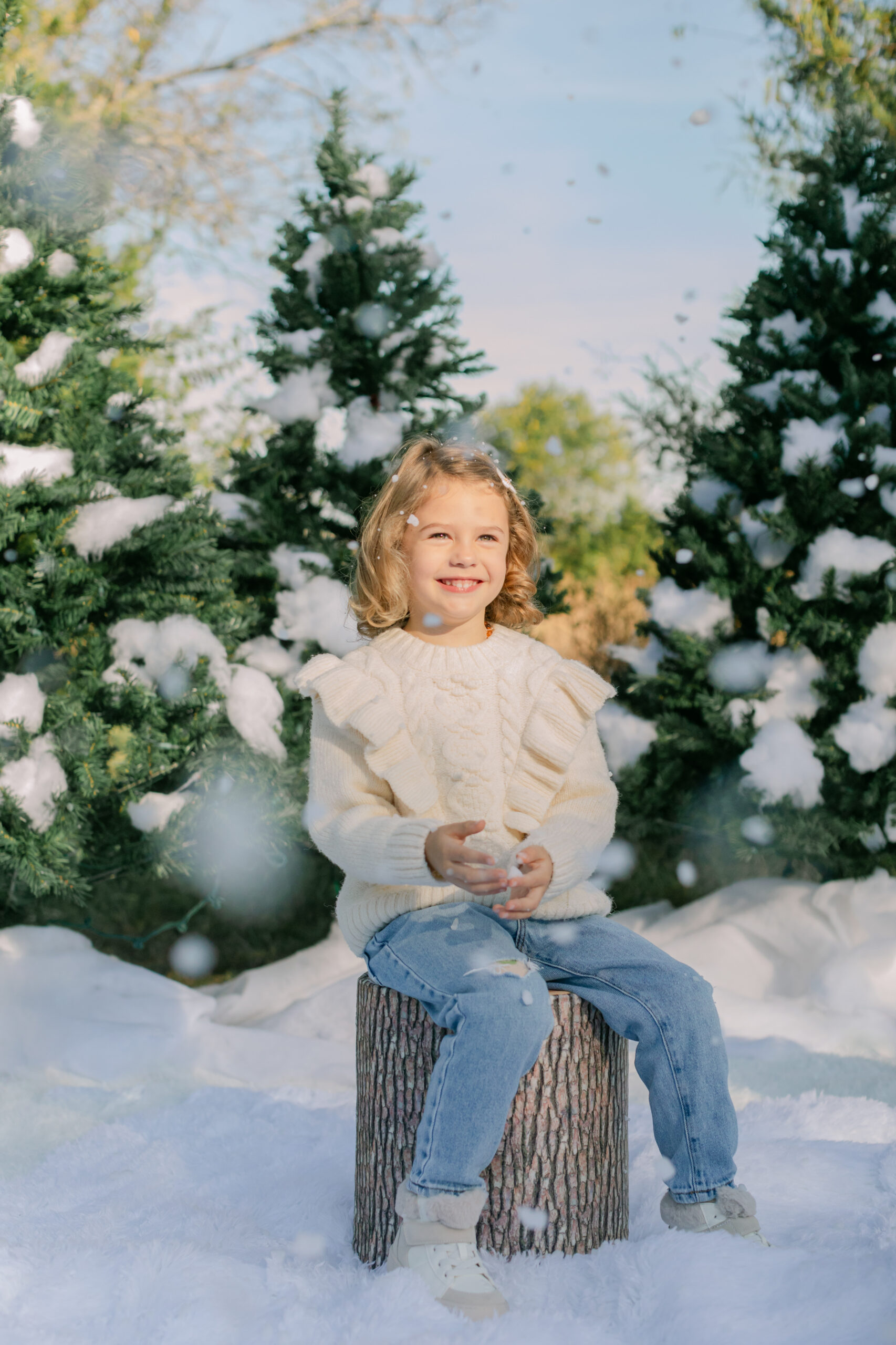 little girl playing with fake snow. snow minis