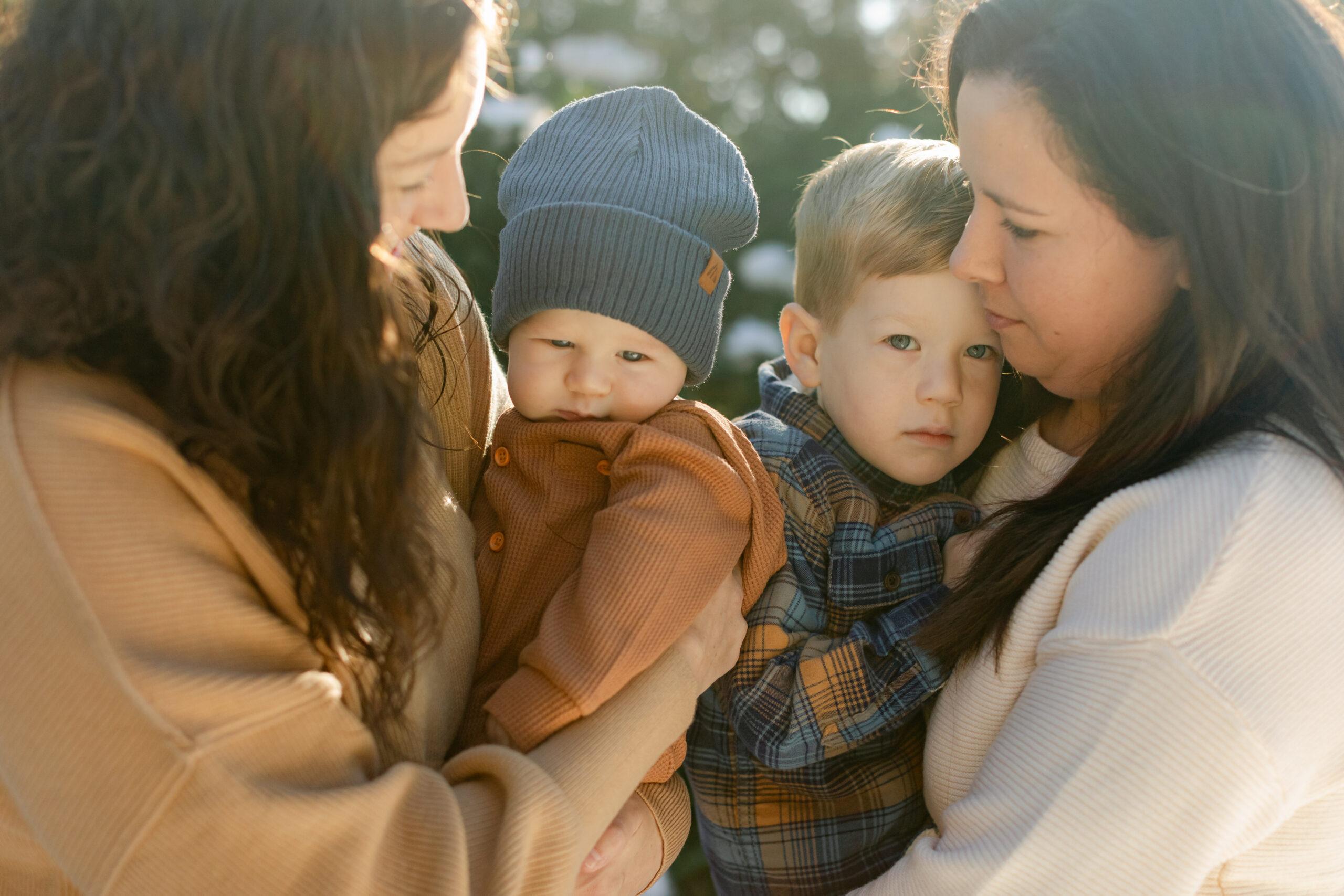 moms and their sons. snowy christmas family photos