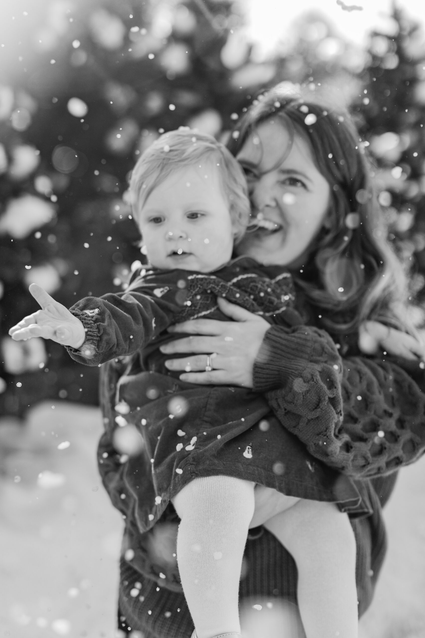 mom and daughter. snowy christmas family photos