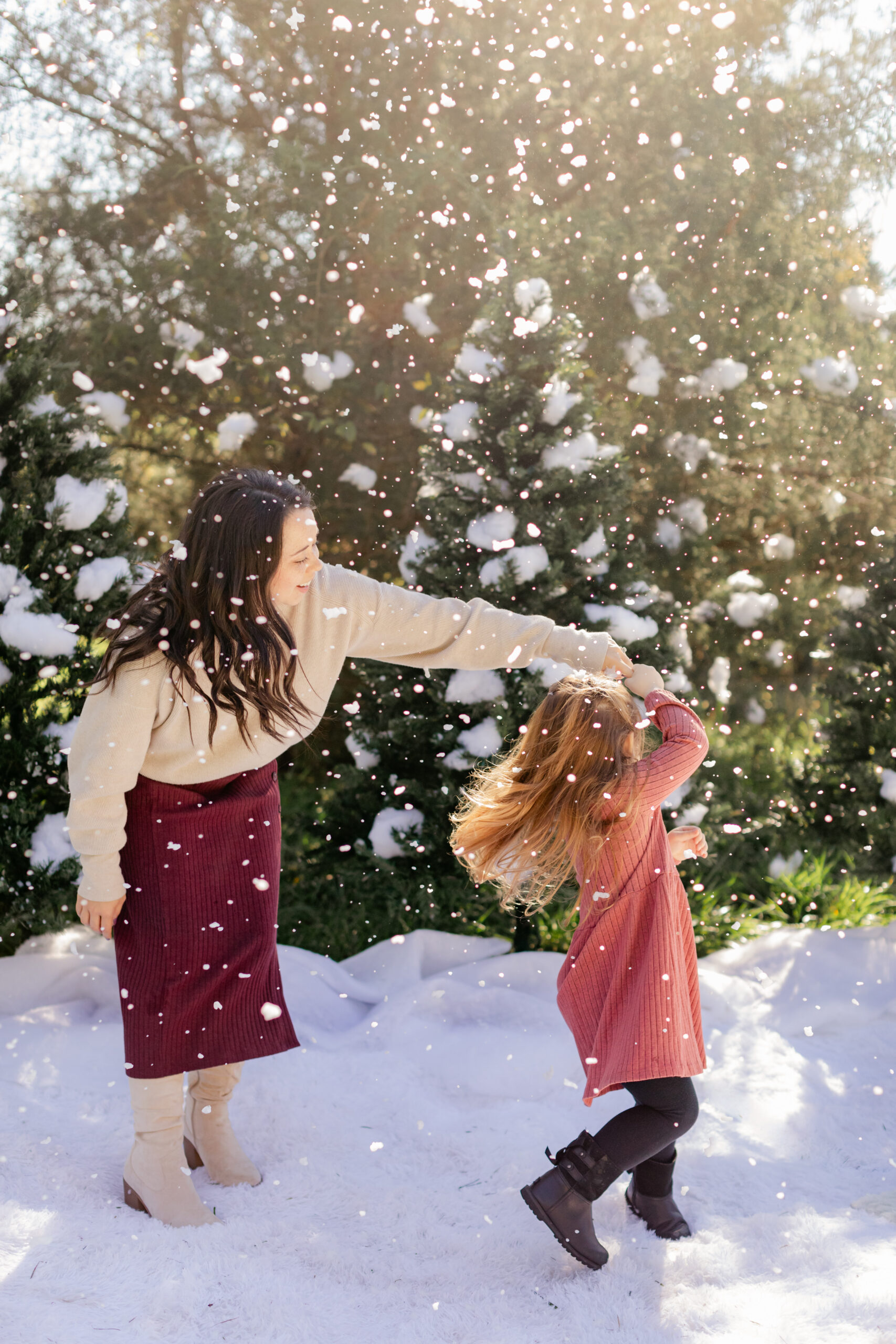 mom and daughter. snowy christmas family photos