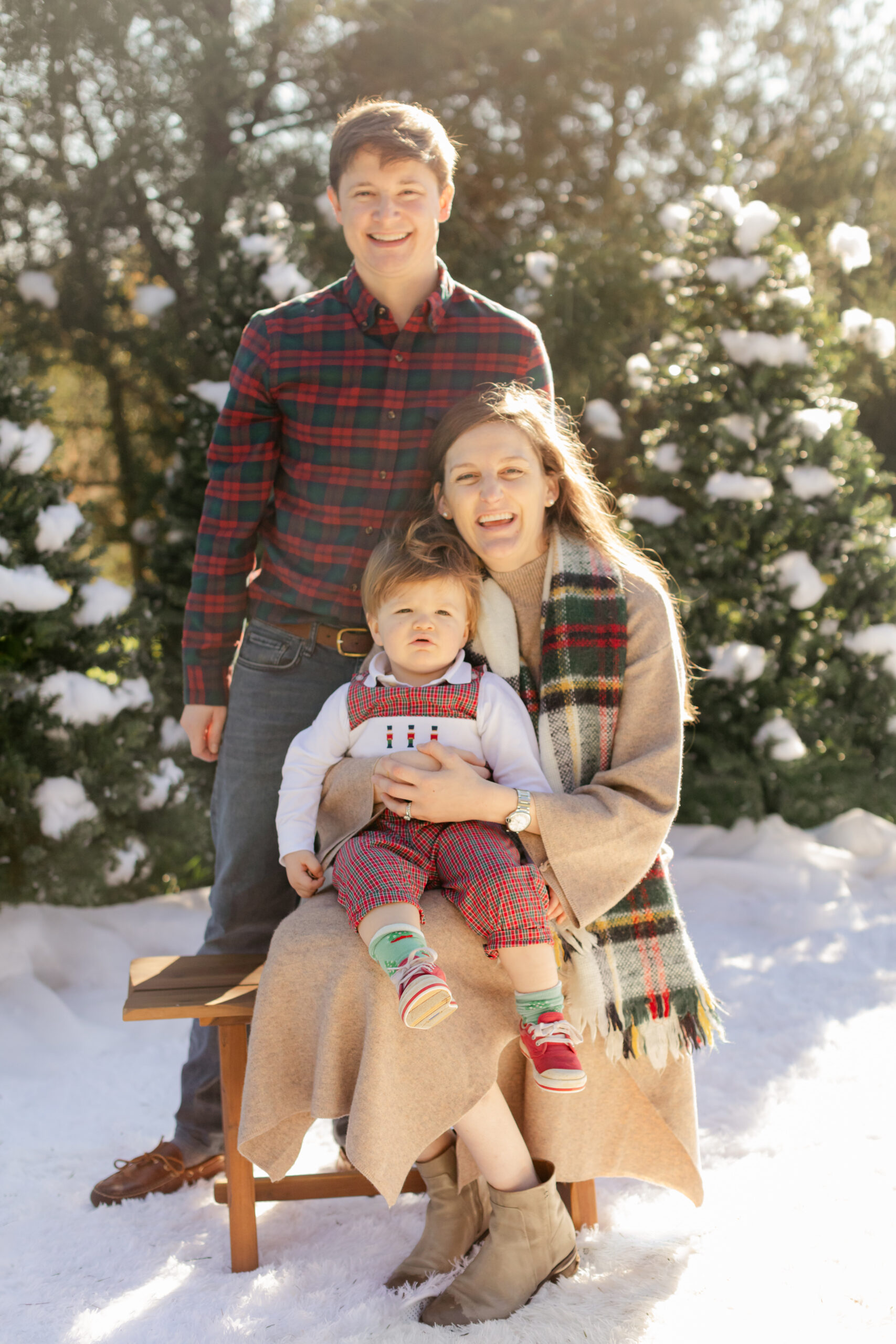 moms and their son. snowy christmas family photos