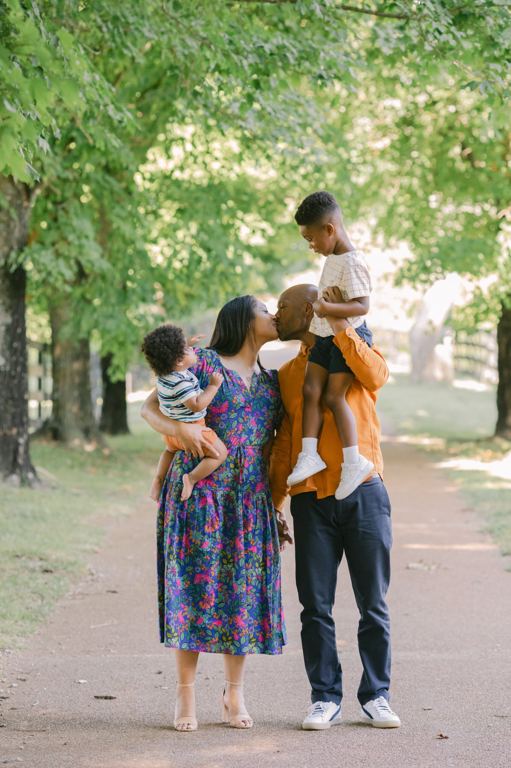 fall family photo (parents with their two young sons)