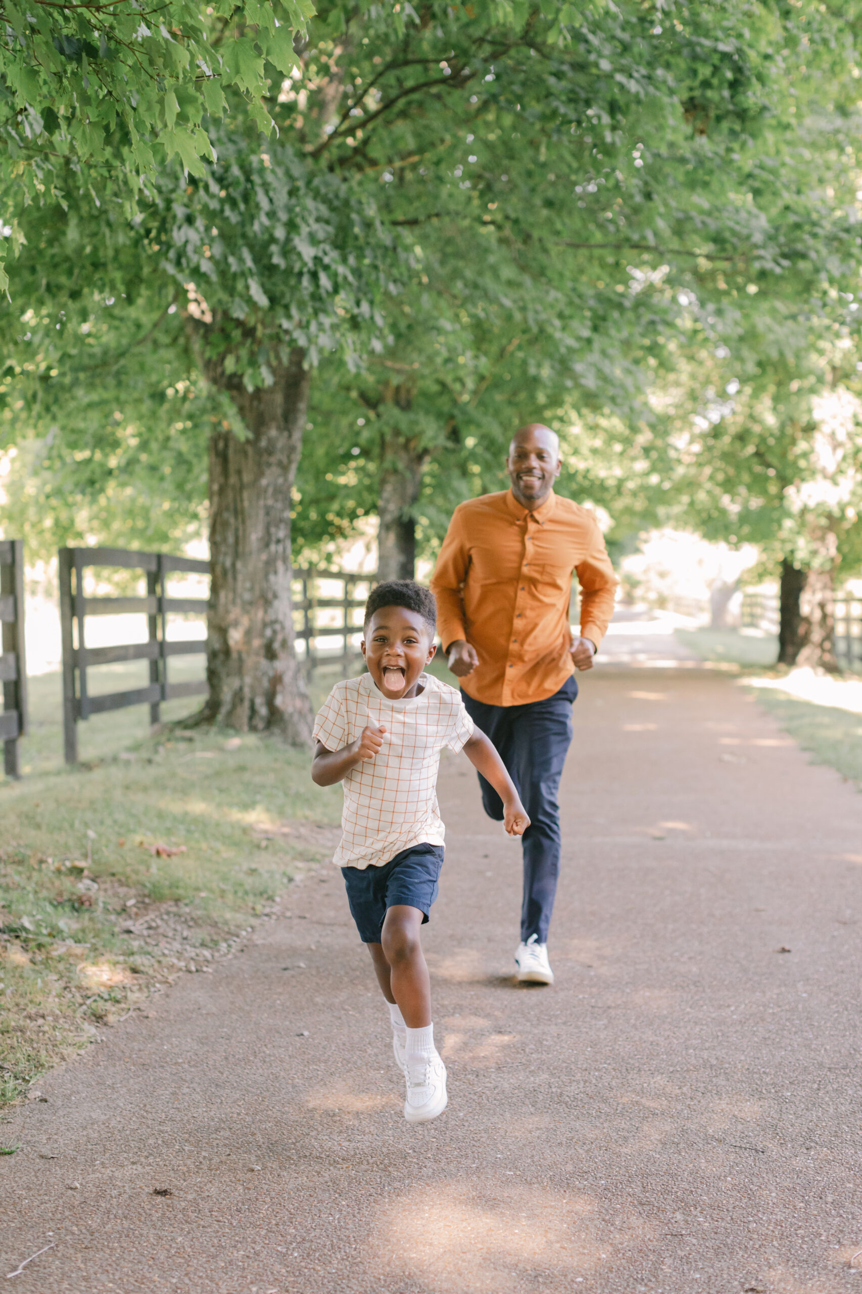 dad chasing young son