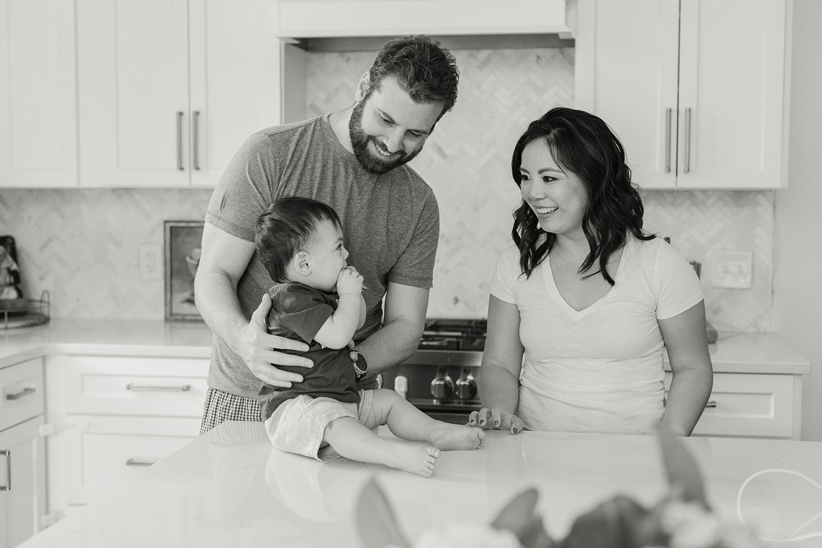 family in kitchen with baby boy. in home family photos.