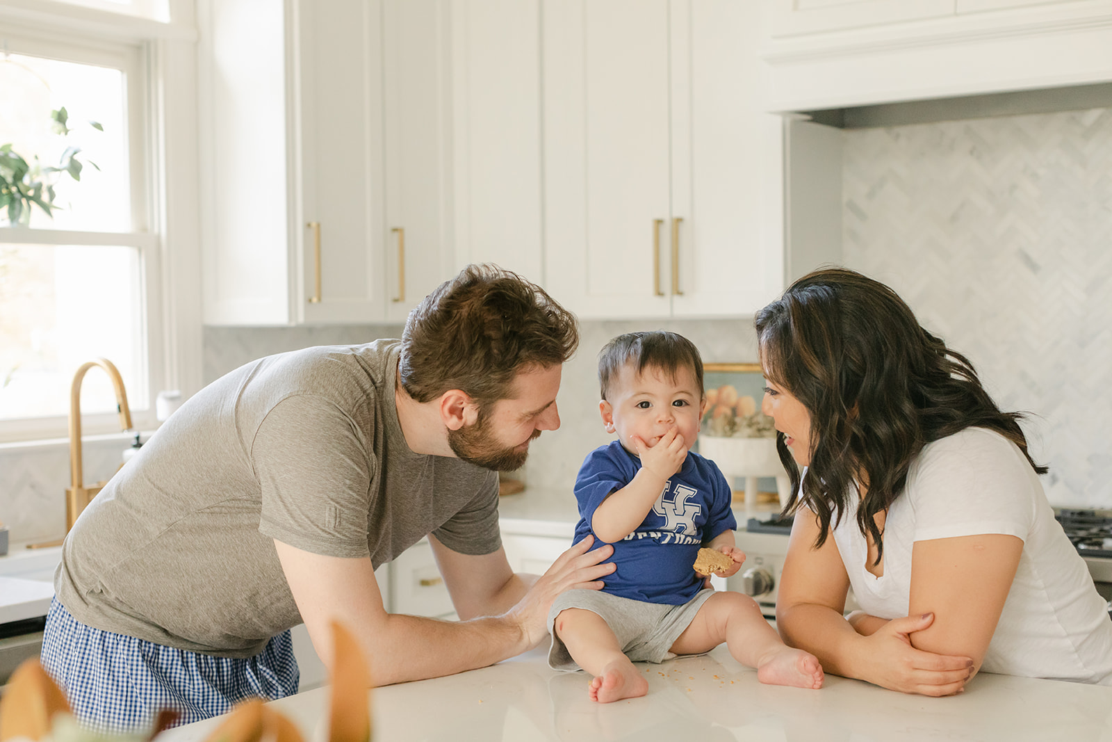 family in kitchen with baby boy. in home family photos.