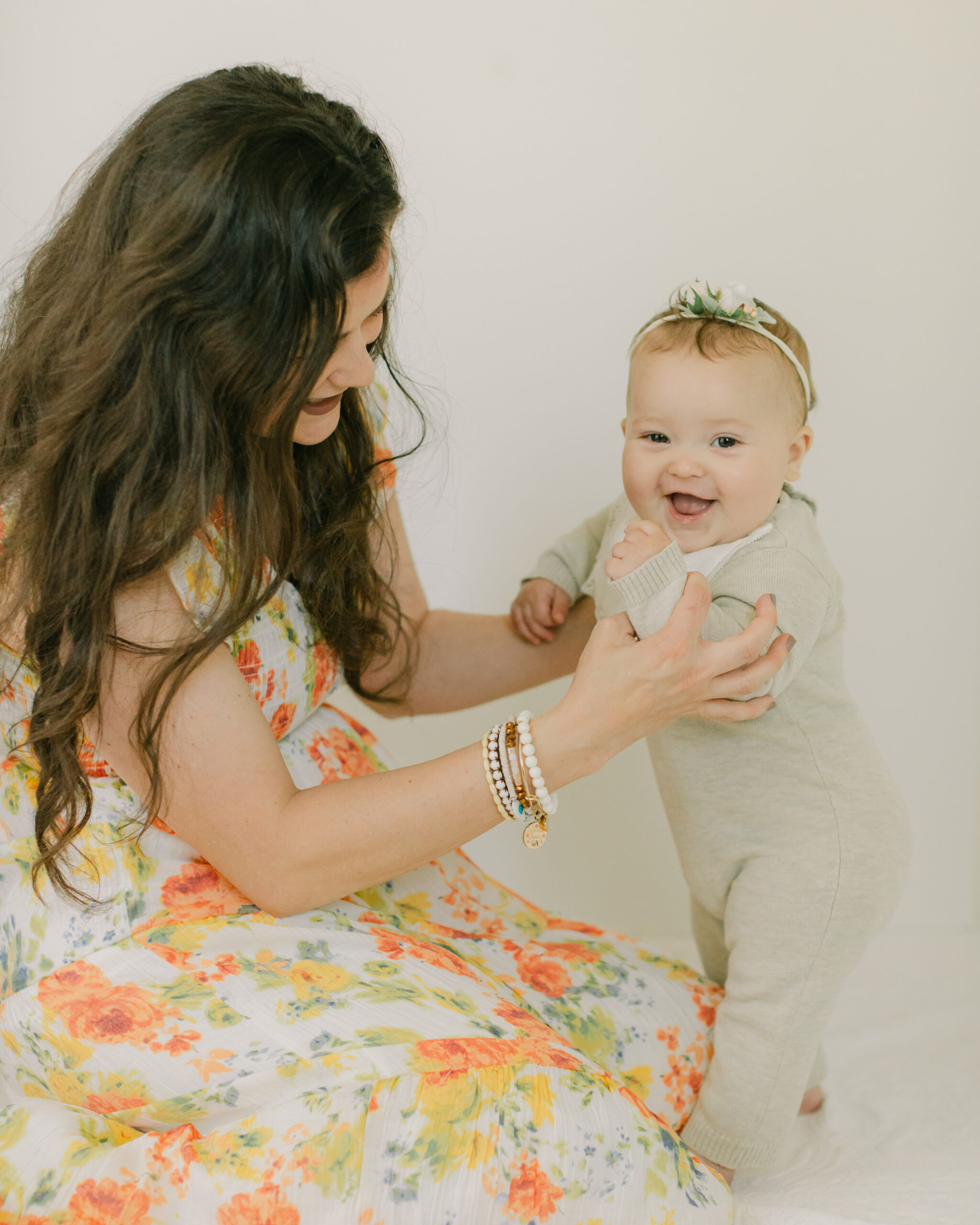 Mama and baby girl. 6 month old baby milestone session